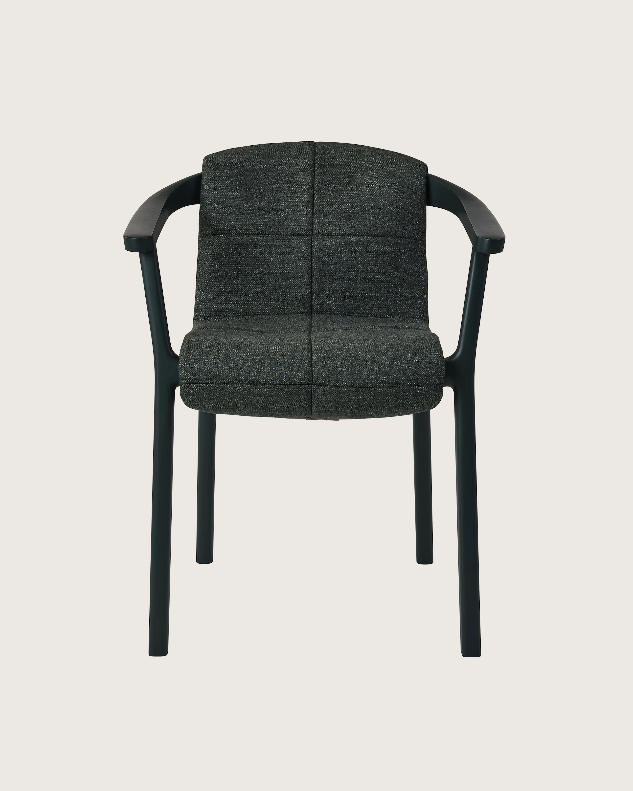Lijn Armchair by Carole Baijings for Geiger in Ivy frame with quilted wrap in Bellano Black Green, front view on a white sweep.