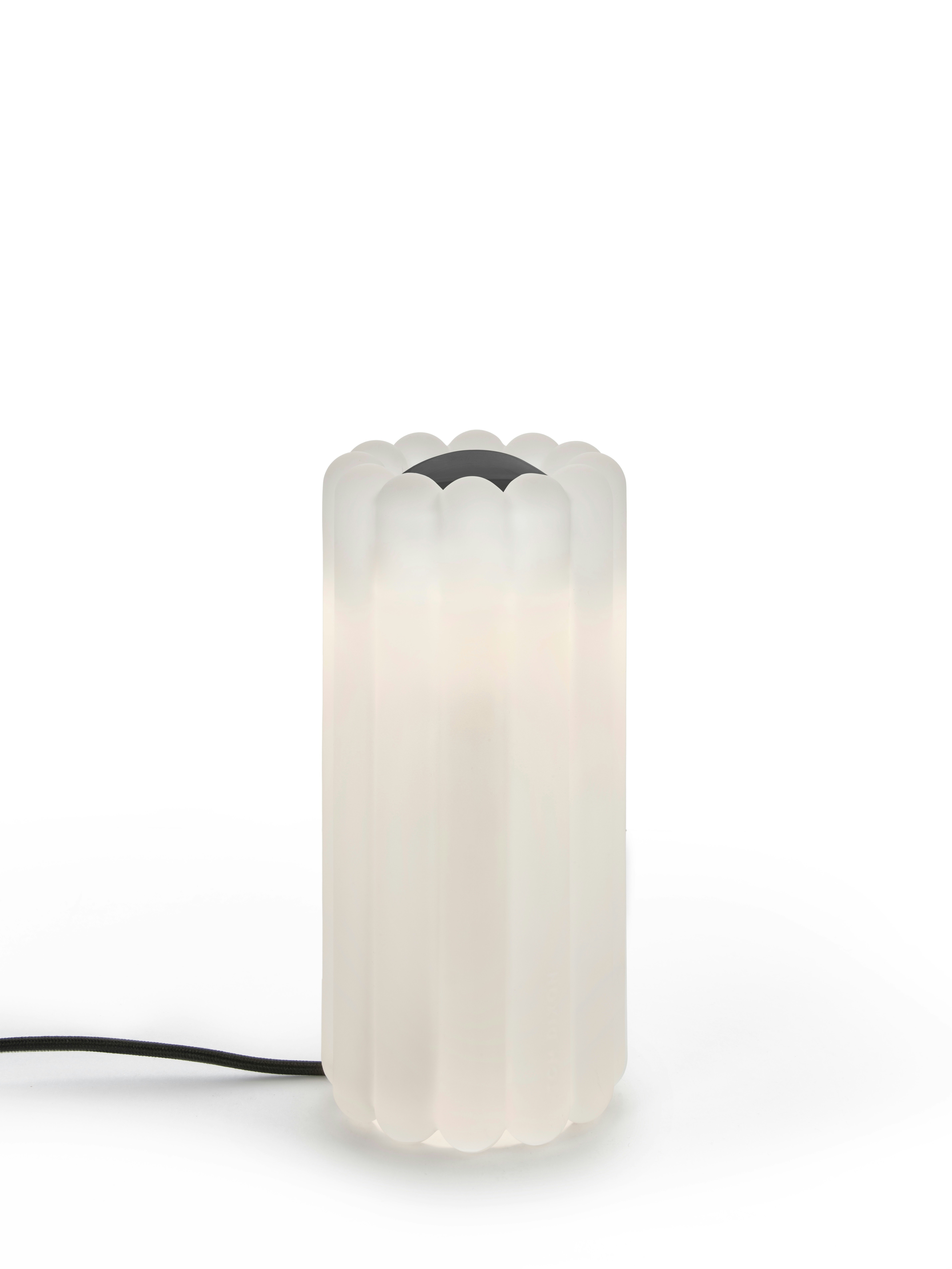 A Press Table Lamp in Glass viewed from the front.