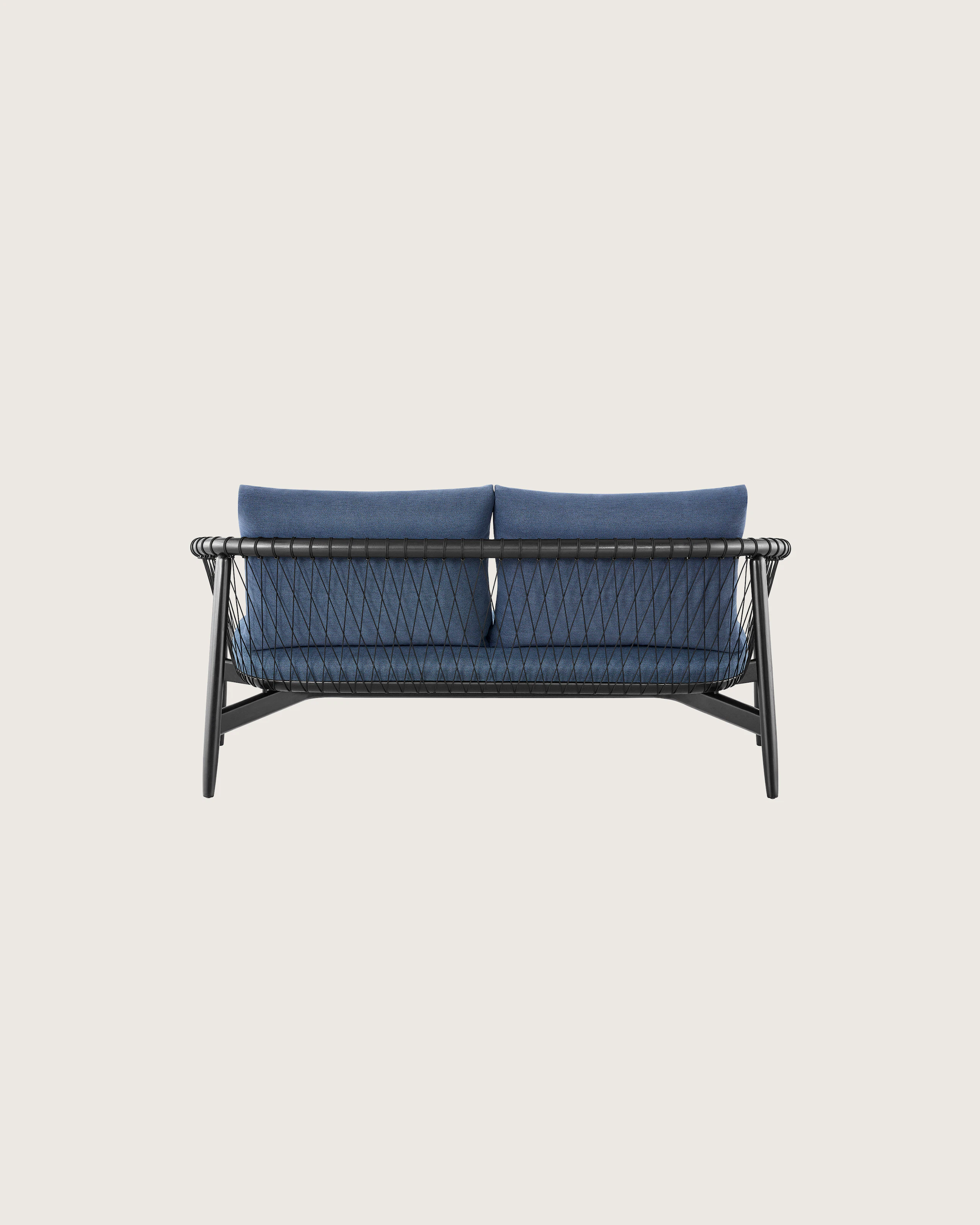 A dark colored Crosshatch Settee featuring navy upholstery and an ebony on ash frame. Viewed from behind.