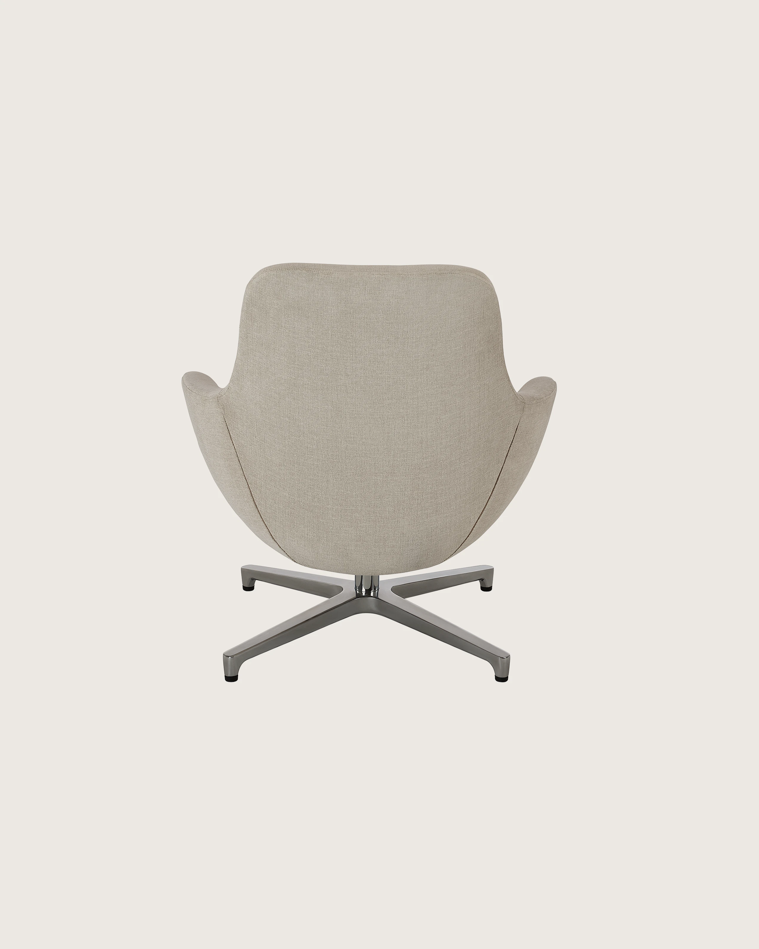 Saiba Lounge Chair designed by Naoto Fukasawa upholstered in Vionette in Desert Mix with a polished aluminum base, shown back-facing on a white sweep.