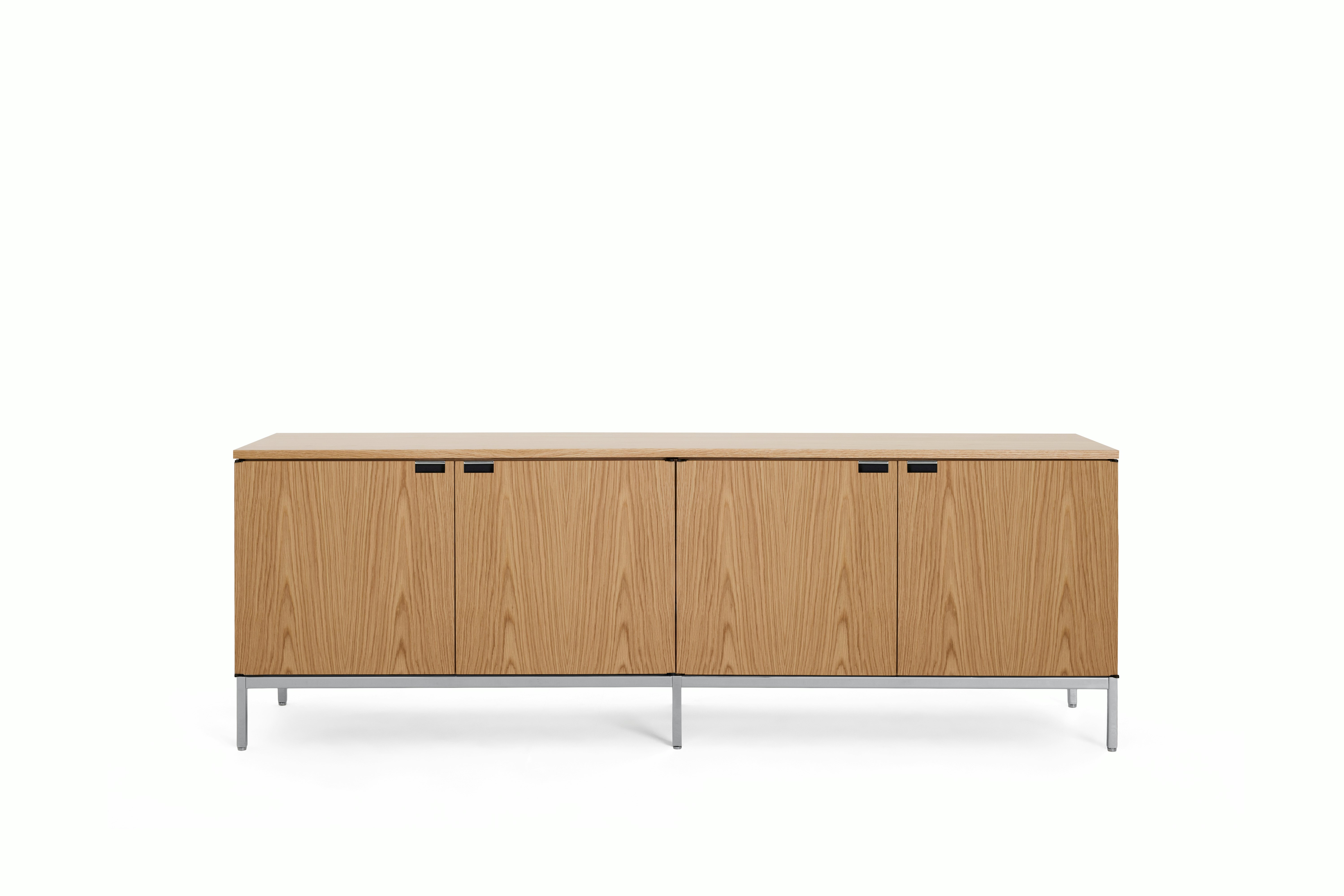 A Florence Knoll Credenza in Large, Four Cabinet, Oak, Veneer, Oak viewed from the front.