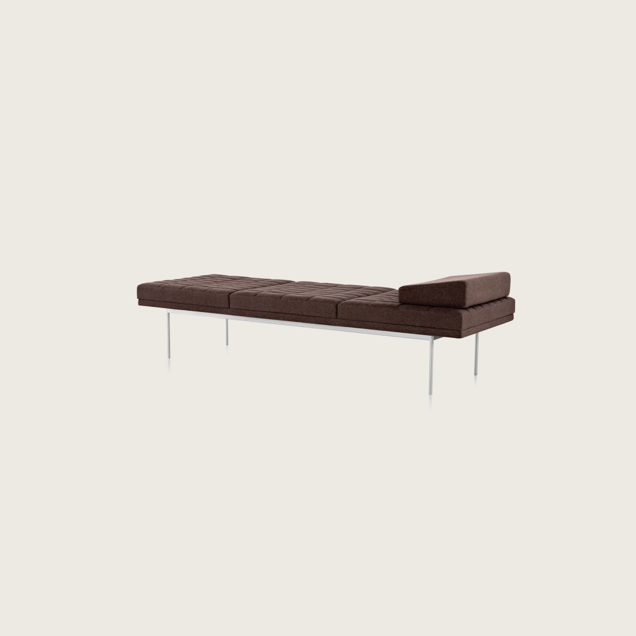 Angled view of a quilted Tuxedo Component daybed upholstered in dark brown fabric.