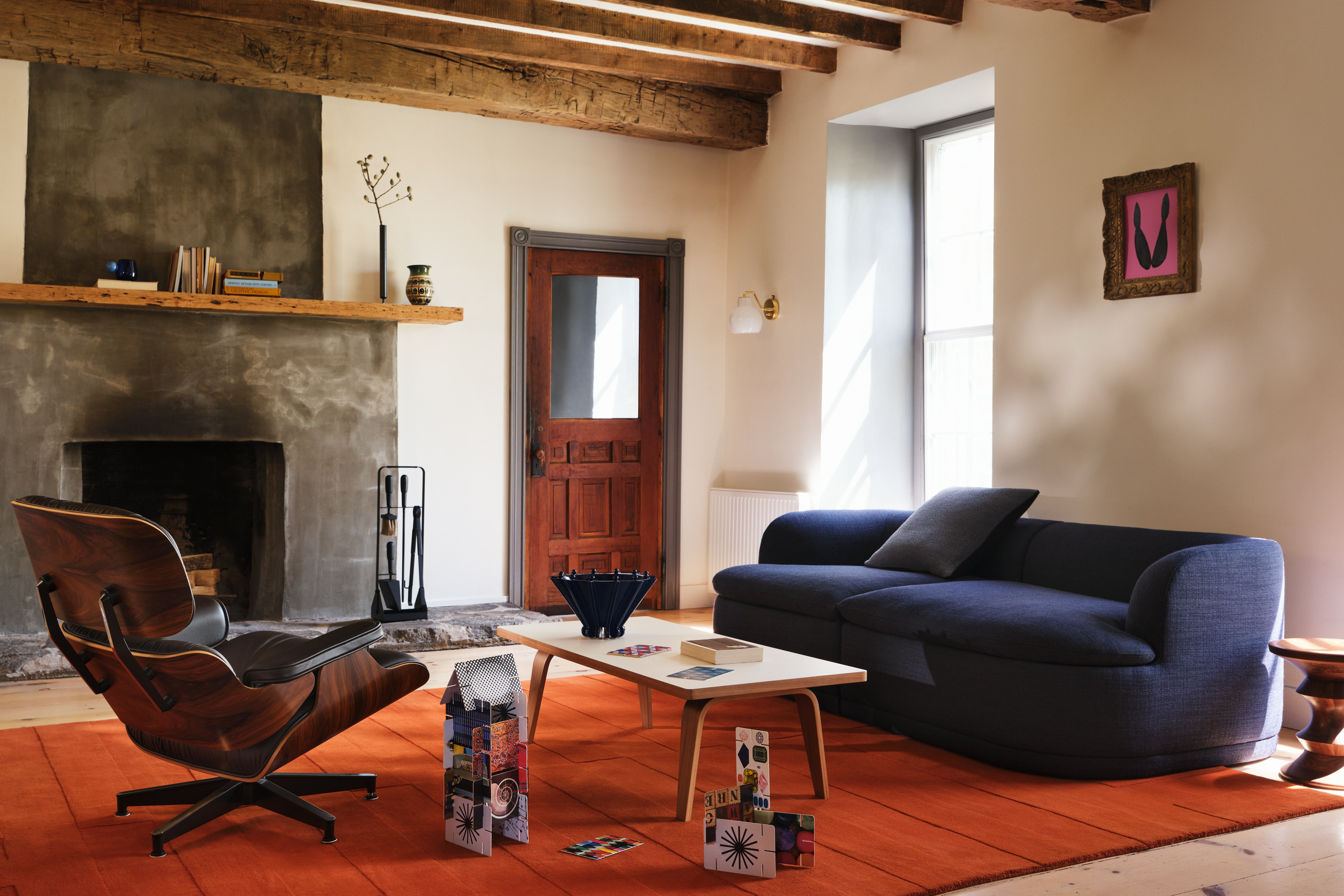 ACMS Sofa in Lapis, Eames Lounge Chair and Eames Coffee Table in a living room