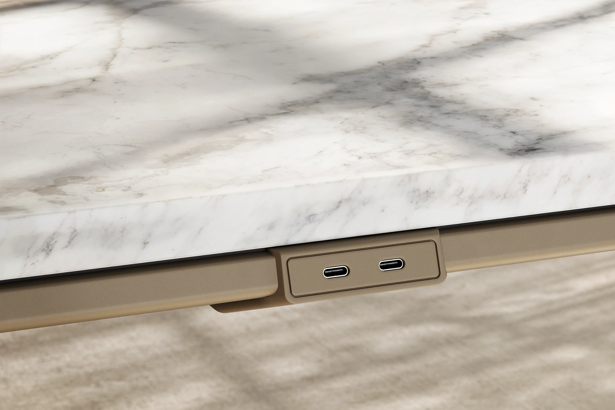 Detail of Ascent Conference Table by EOOS in White Carrara marble showing edge with power access in silk bronze viewed at an angle.
