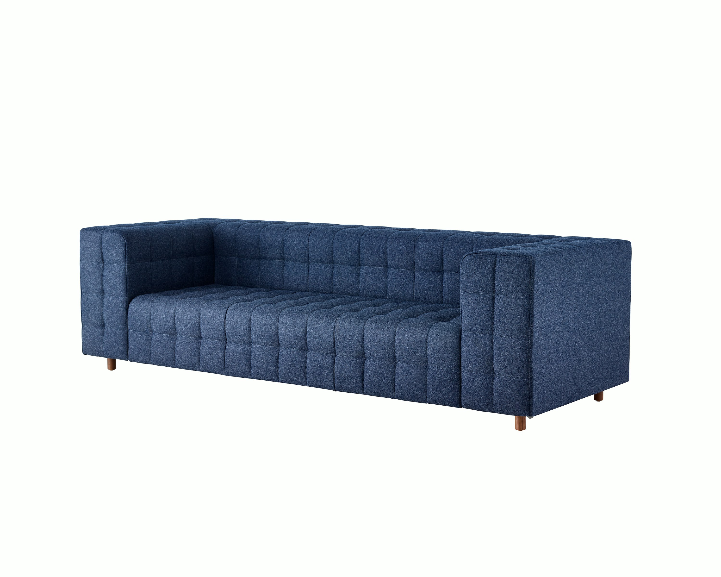 A three-seat Rapport Sofa in a deep navy colored textile, viewed at an angle.