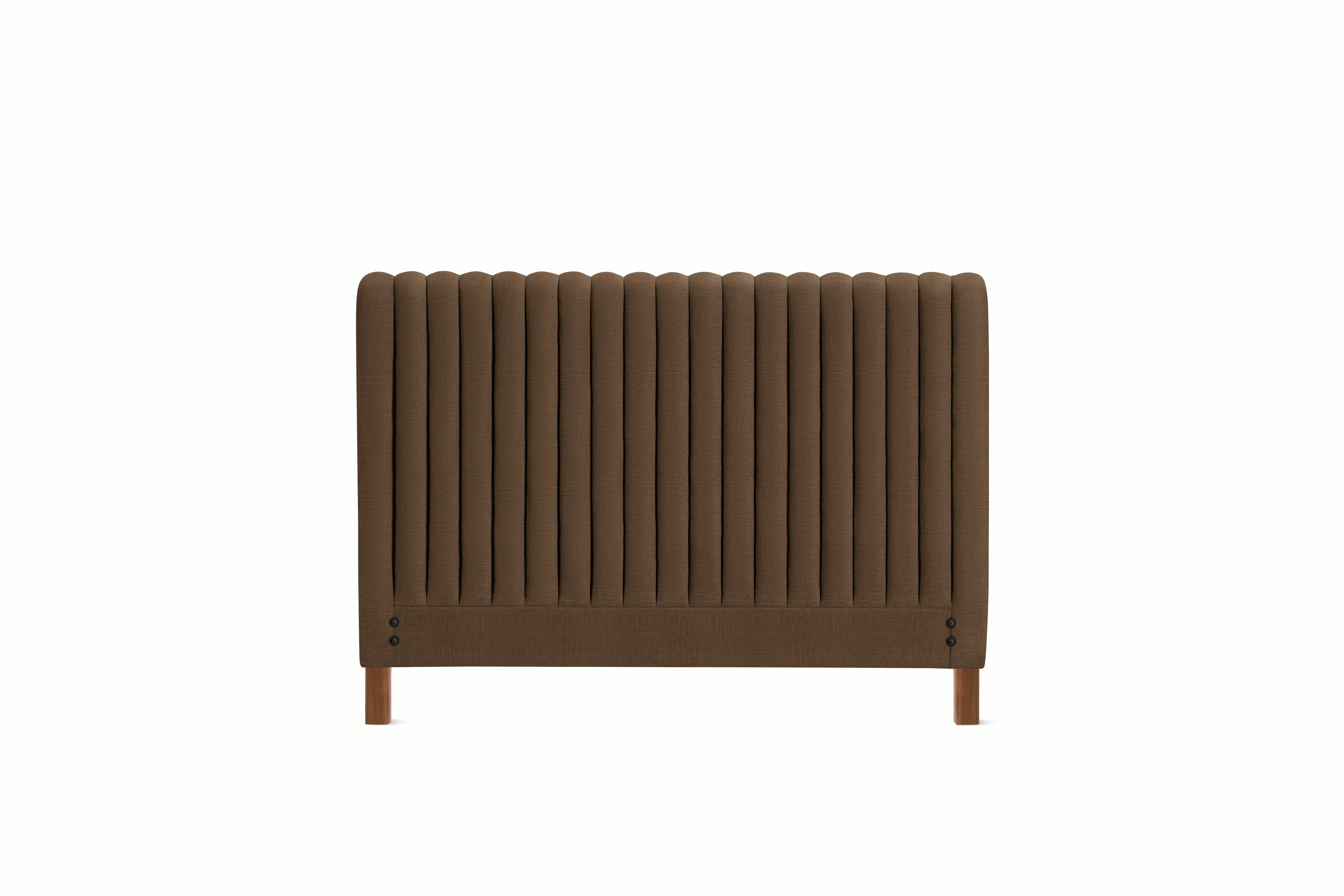 A Charlotte Headboard in Walnut viewed from an angle.