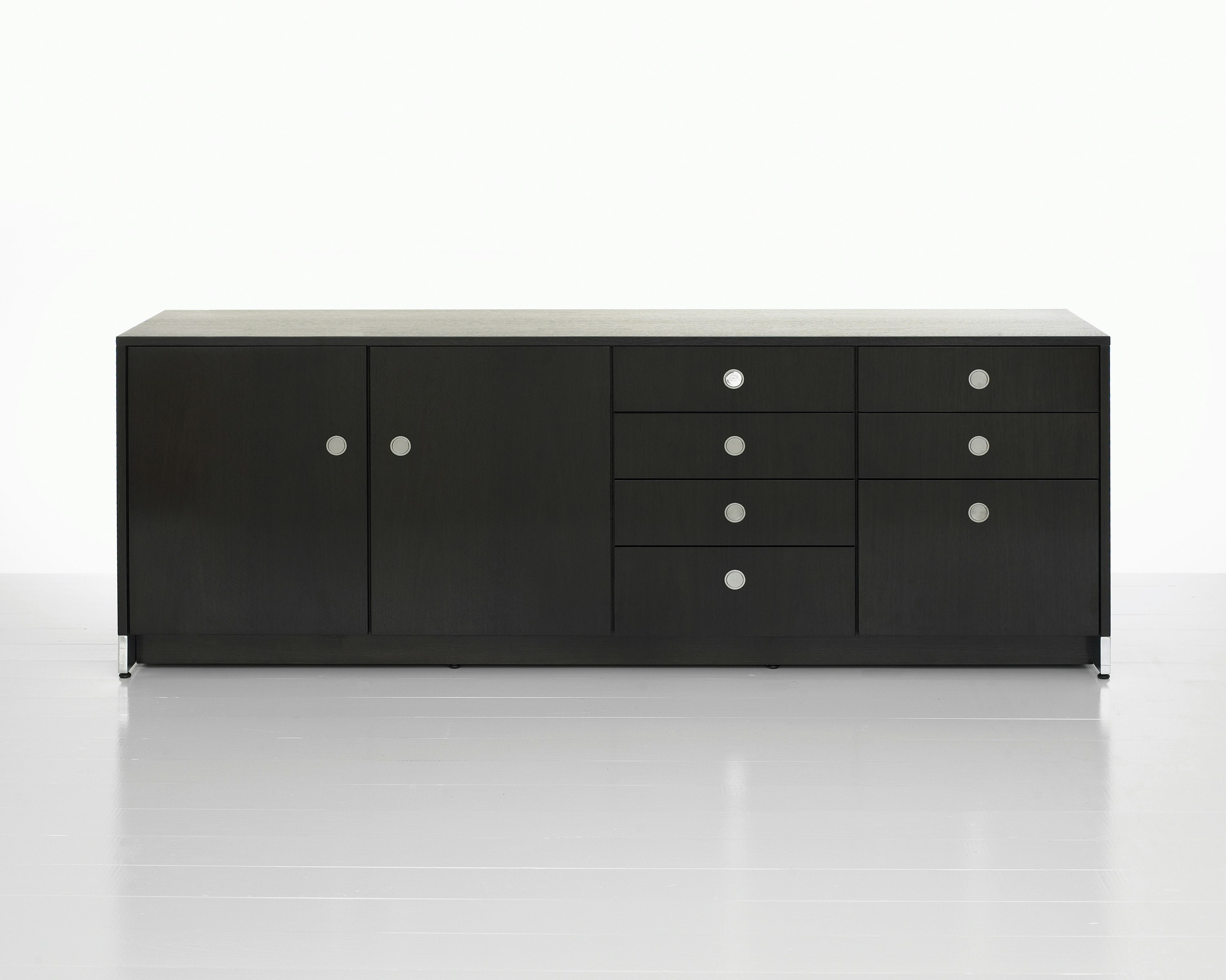 A four-unit Sled Base Storage credenza with a dark wood finish and a combination of hinged doors, box drawers, and file storage.