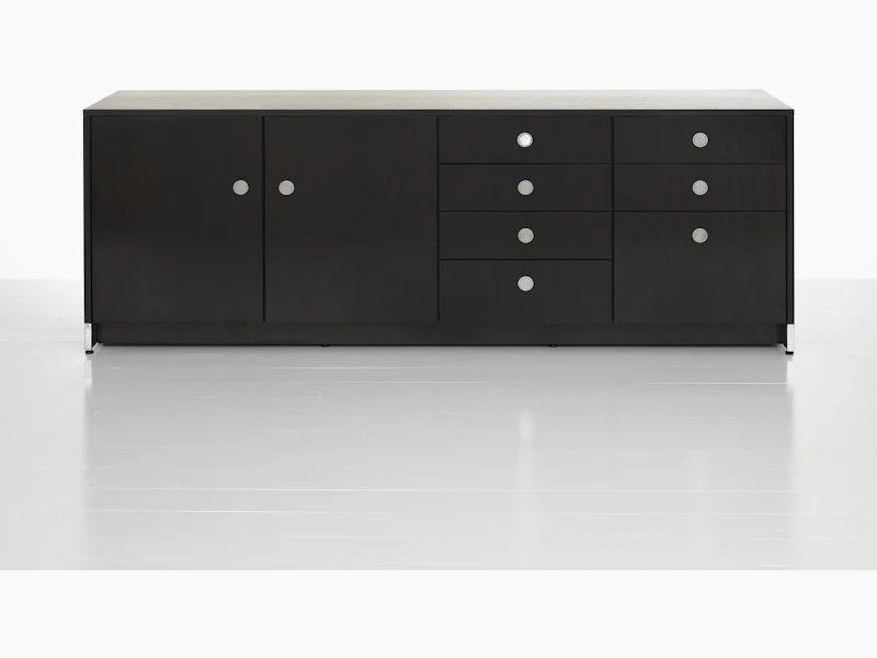 A four-unit Sled Base Storage credenza with a dark wood finish and a combination of hinged doors, box drawers, and file storage.