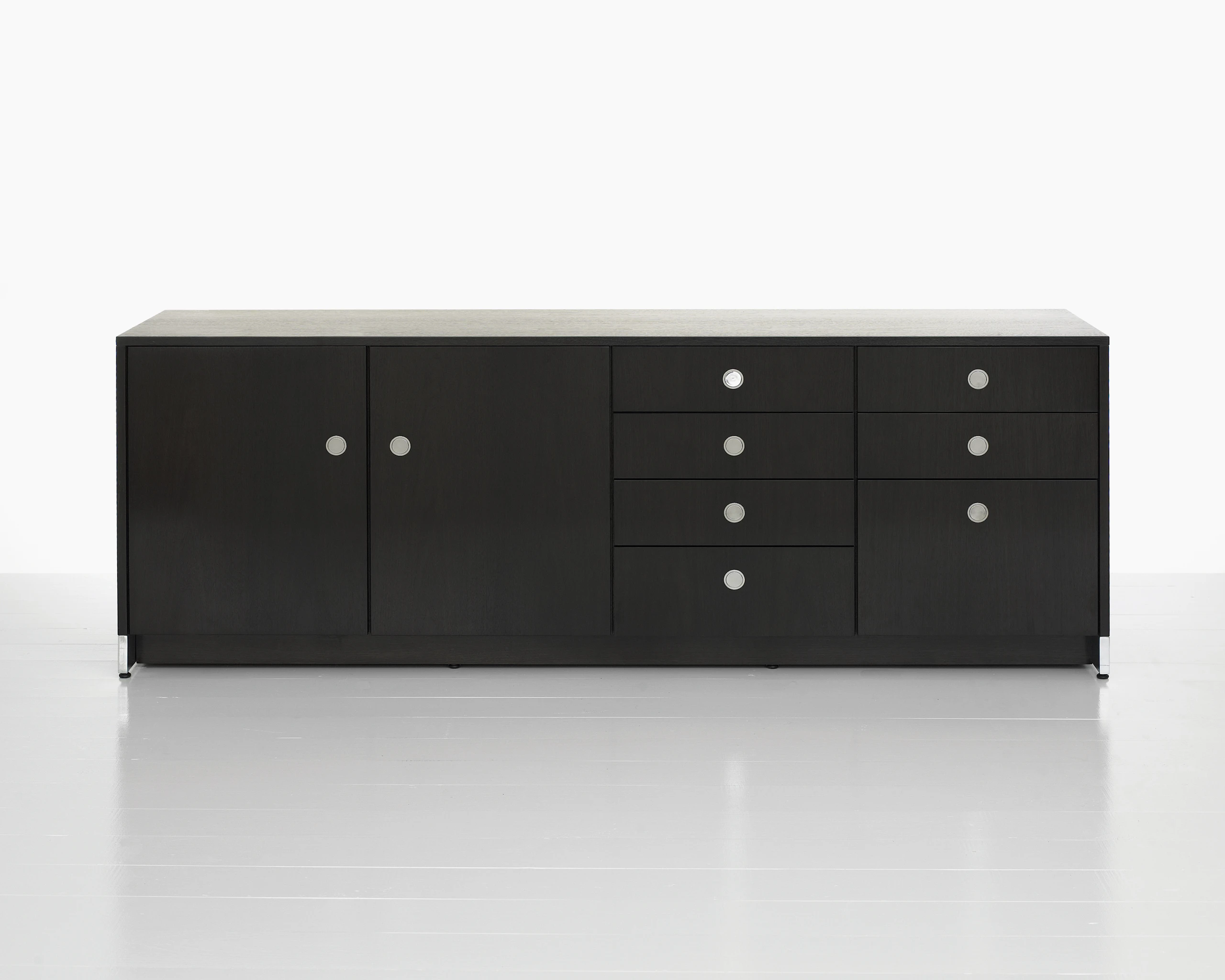 A four-unit Sled Base Storage credenza with a dark wood finish and a combination of hinged doors, box drawers, and file storage.