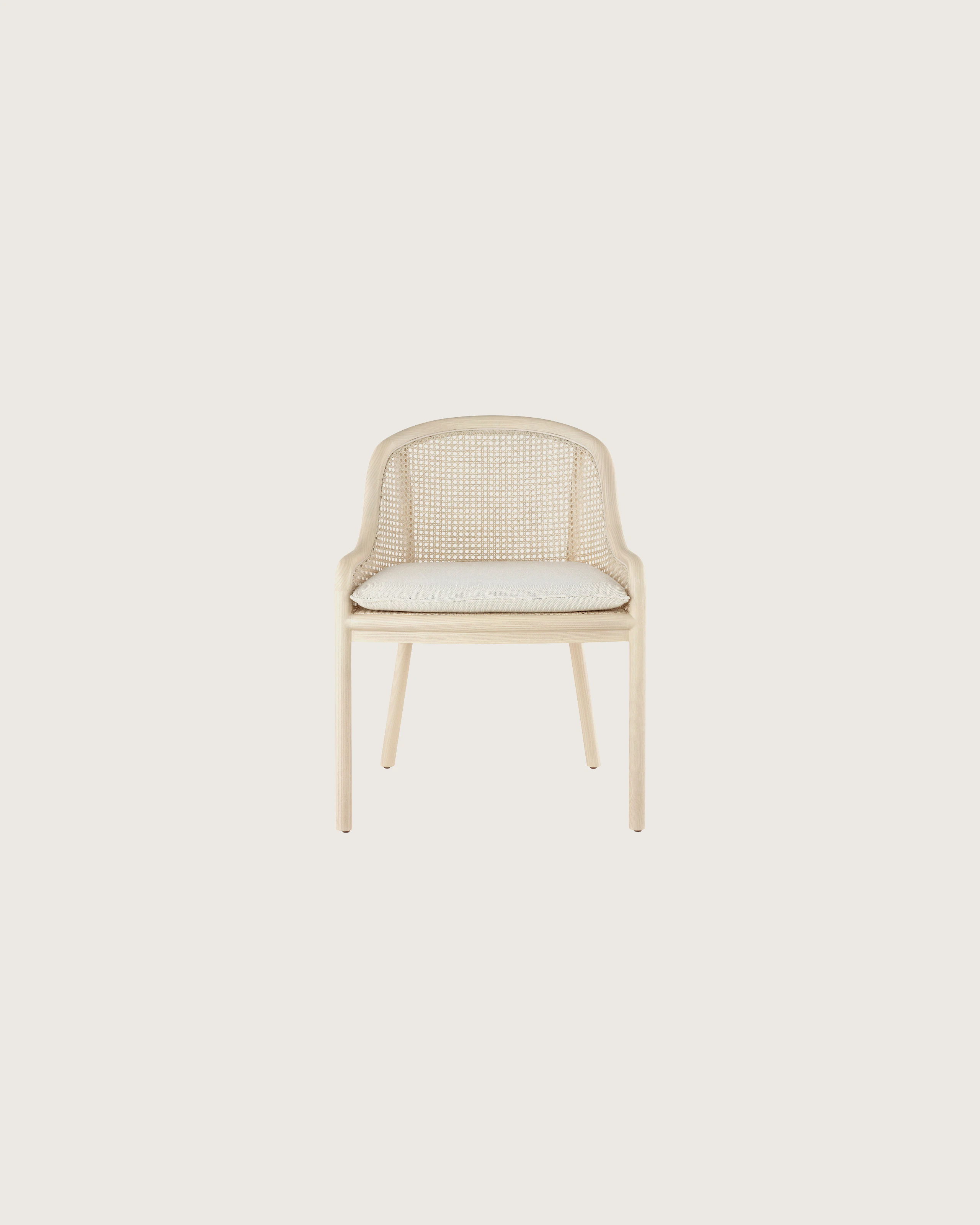 Landmark Chair with a cane back and a seat upholstered in a Double Beam textile, viewed from the front.