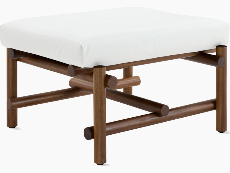 A Muecke Ottoman in White Walnut viewed from an angle.