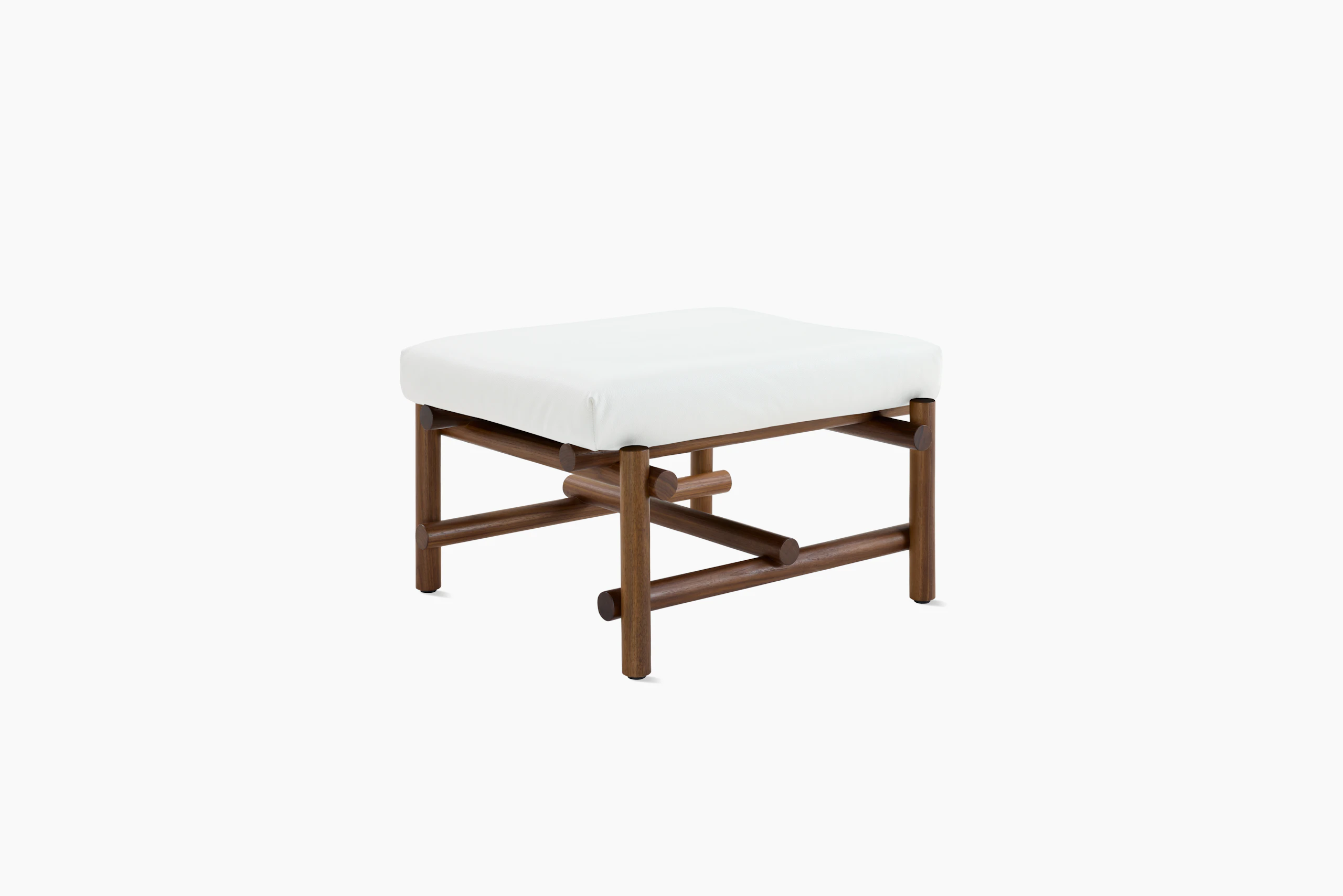 A Muecke Ottoman in White Walnut viewed from an angle.
