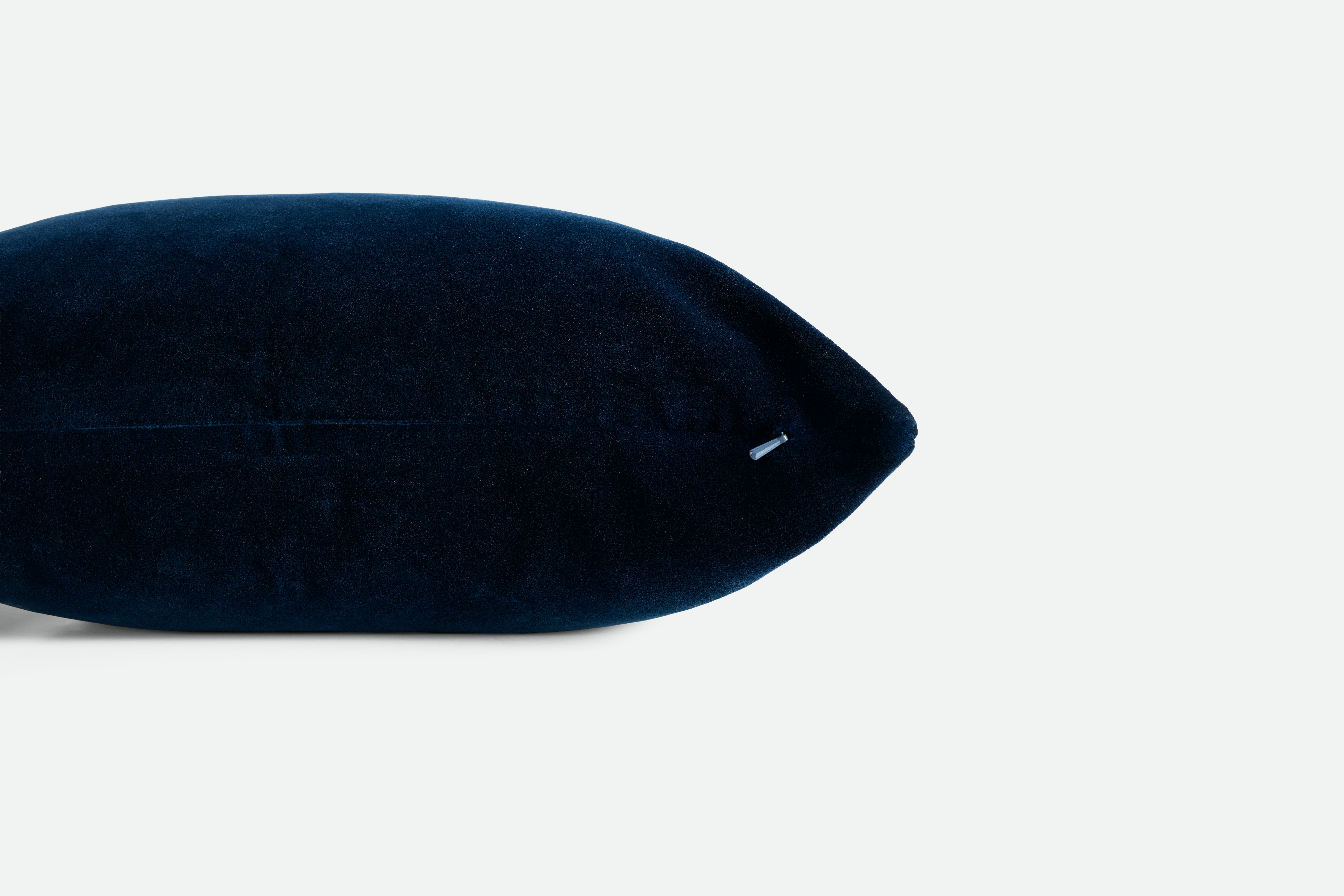 A detailed look at a Cotton Velvet Pillow in Ocean Blue.