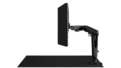 A black Ollin Monitor Arm attached to a black desk