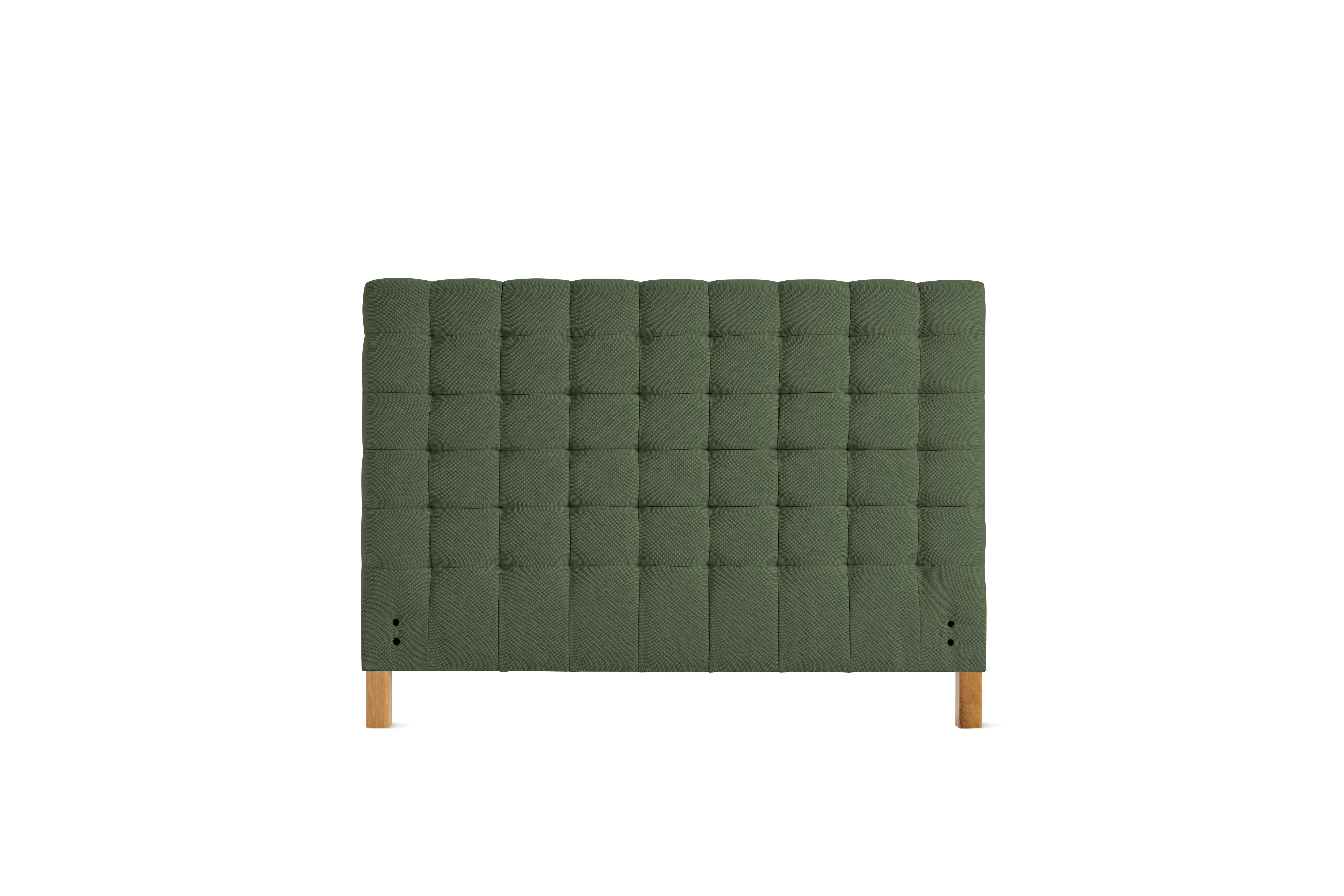 A Madeleine Headboard in Mode, Genus, Oak viewed from the front.