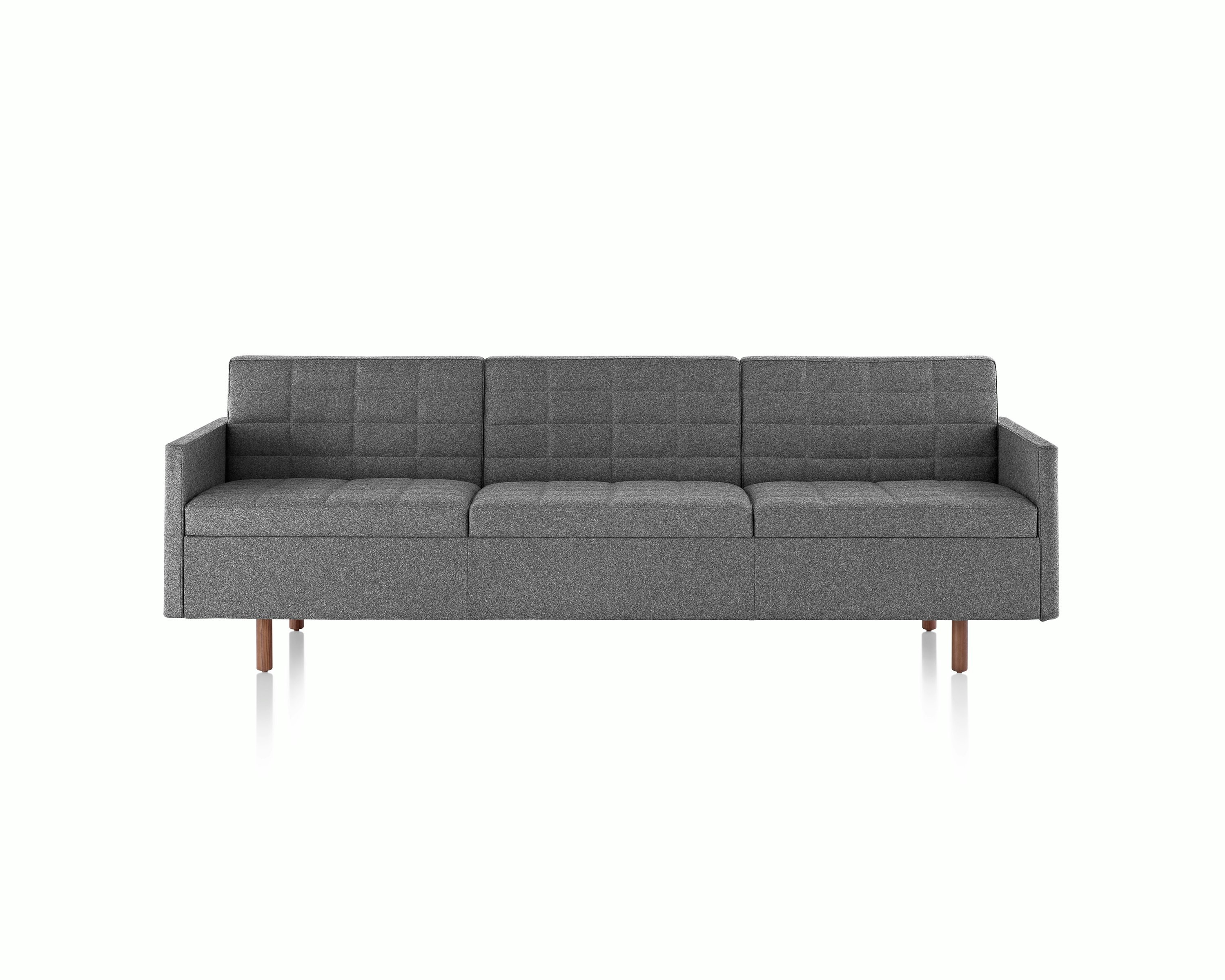 A Tuxedo Classic sofa with dark gray quilted upholstery, viewed from the front.