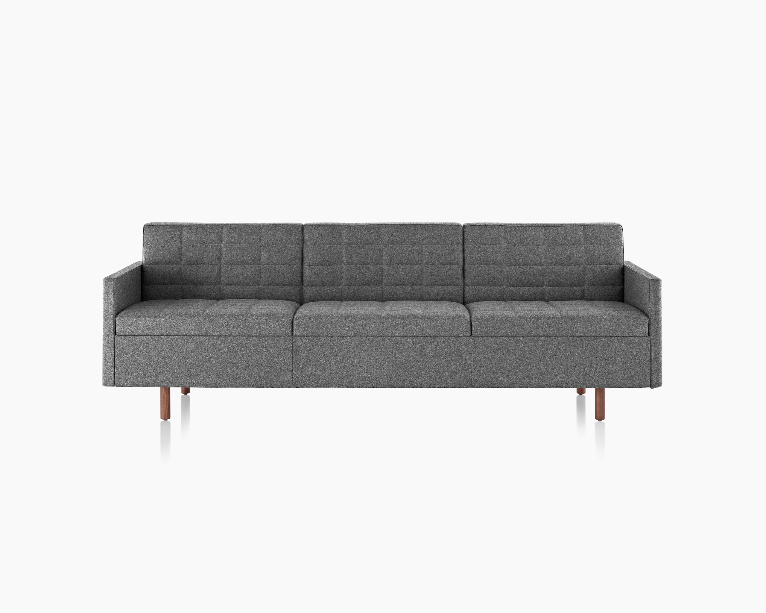 A Tuxedo Classic sofa with dark gray quilted upholstery, viewed from the front.