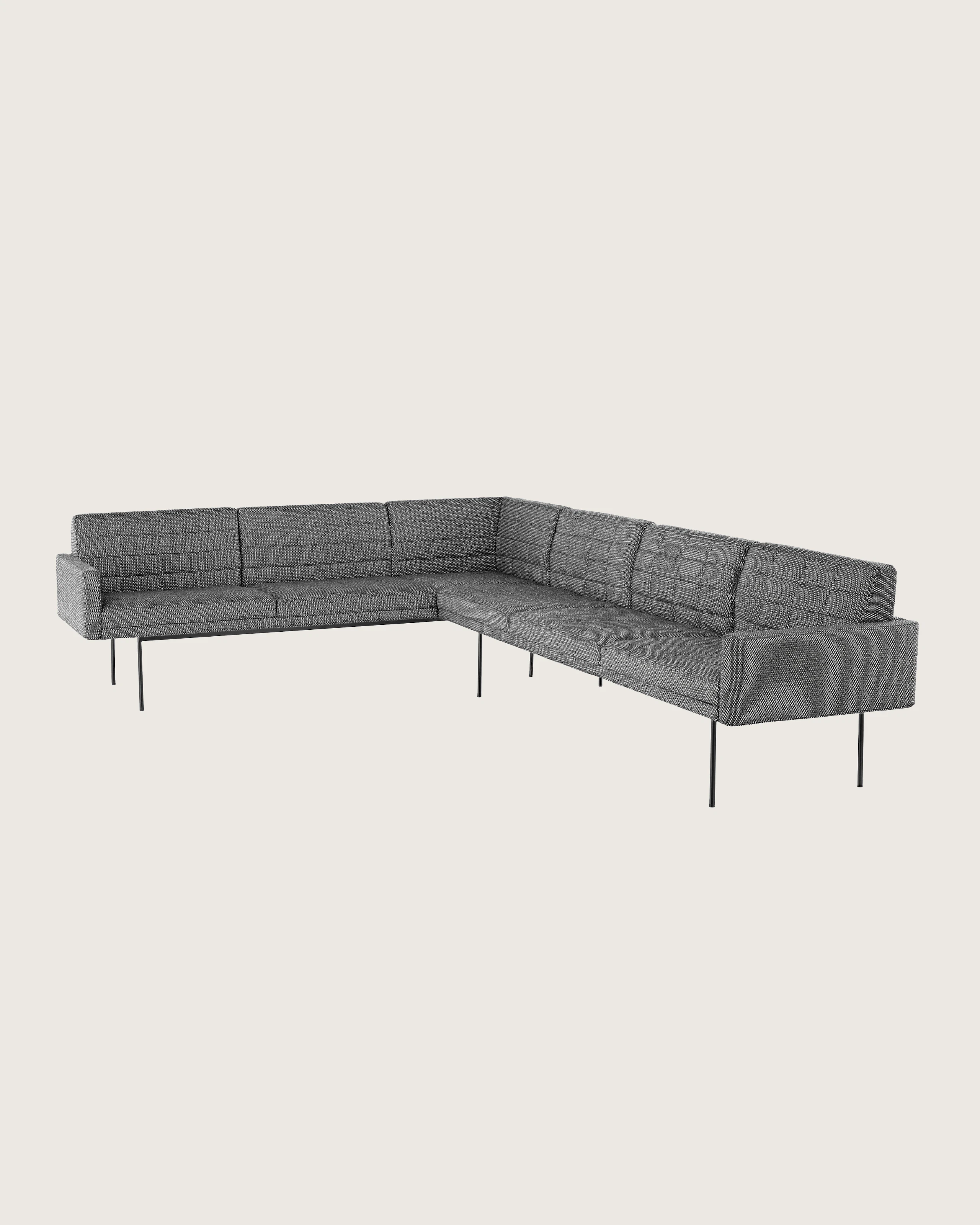 A quilted Tuxedo Component sectional upholstered in gray fabric.