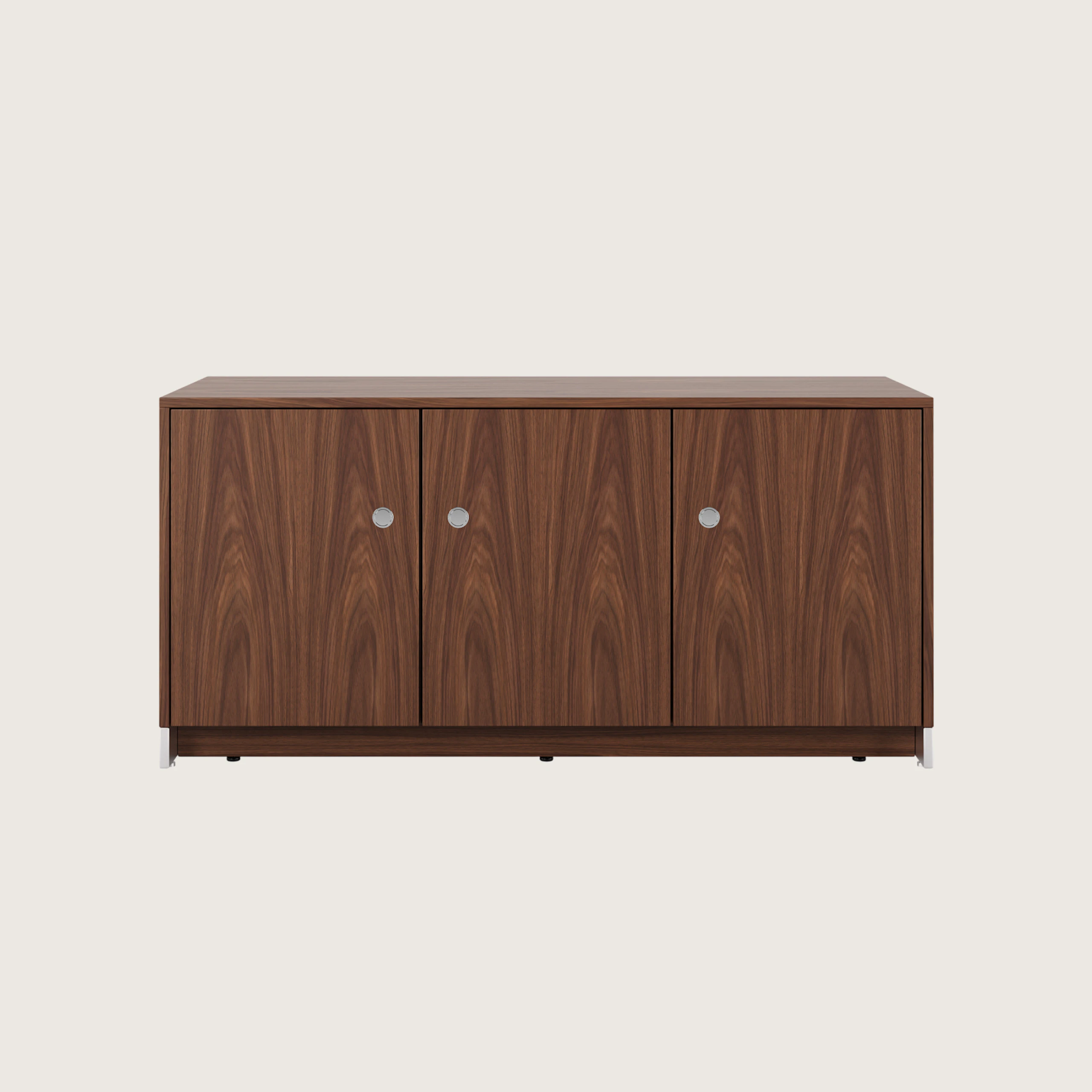 52.5 inch wide Sled Base Credenza with shelf storage in walnut with a chrome base and pulls viewed from the front.