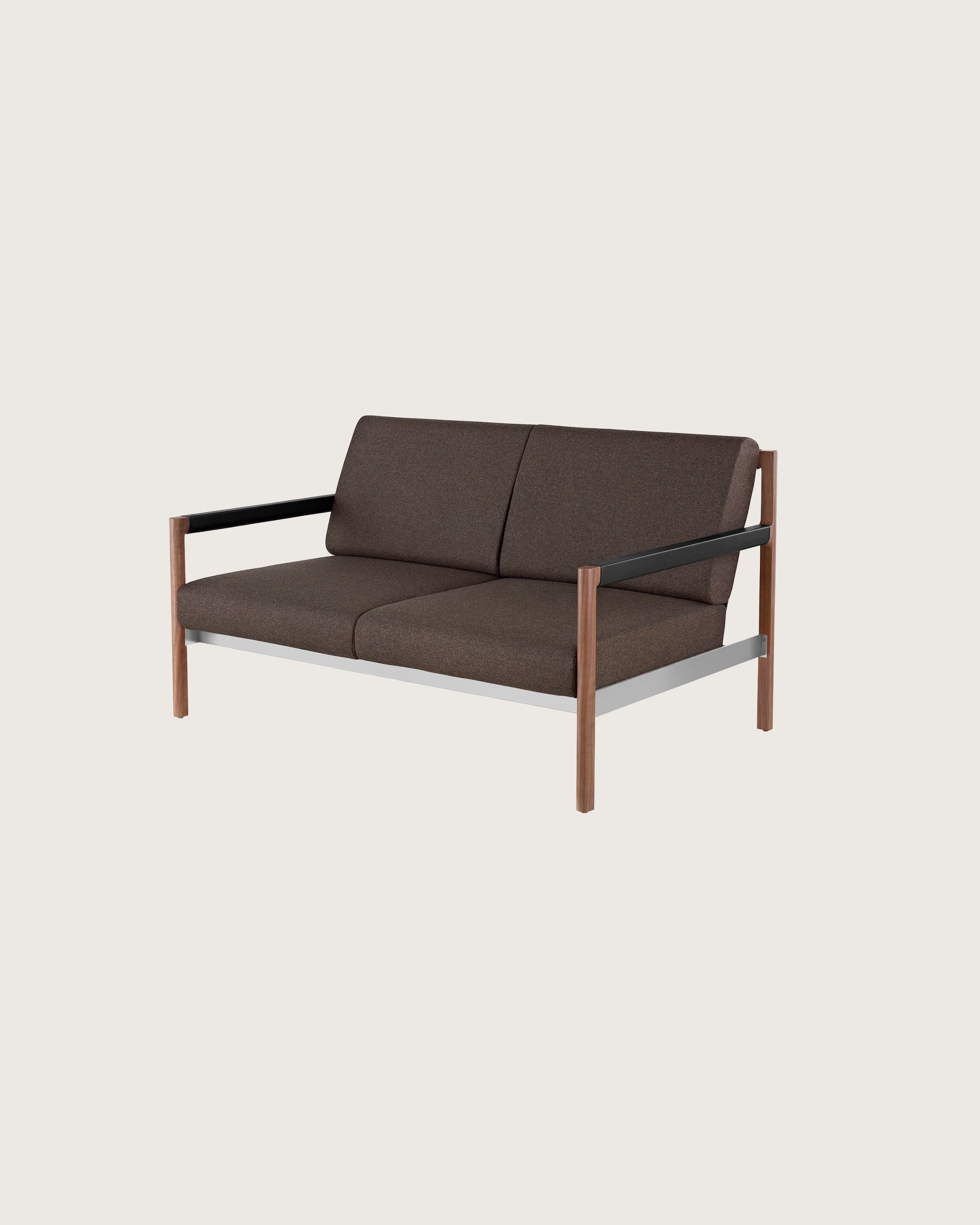 A Brabo Settee with dark upholstery, leather and metal accents, and an exposed wood frame. Viewed at an angle.