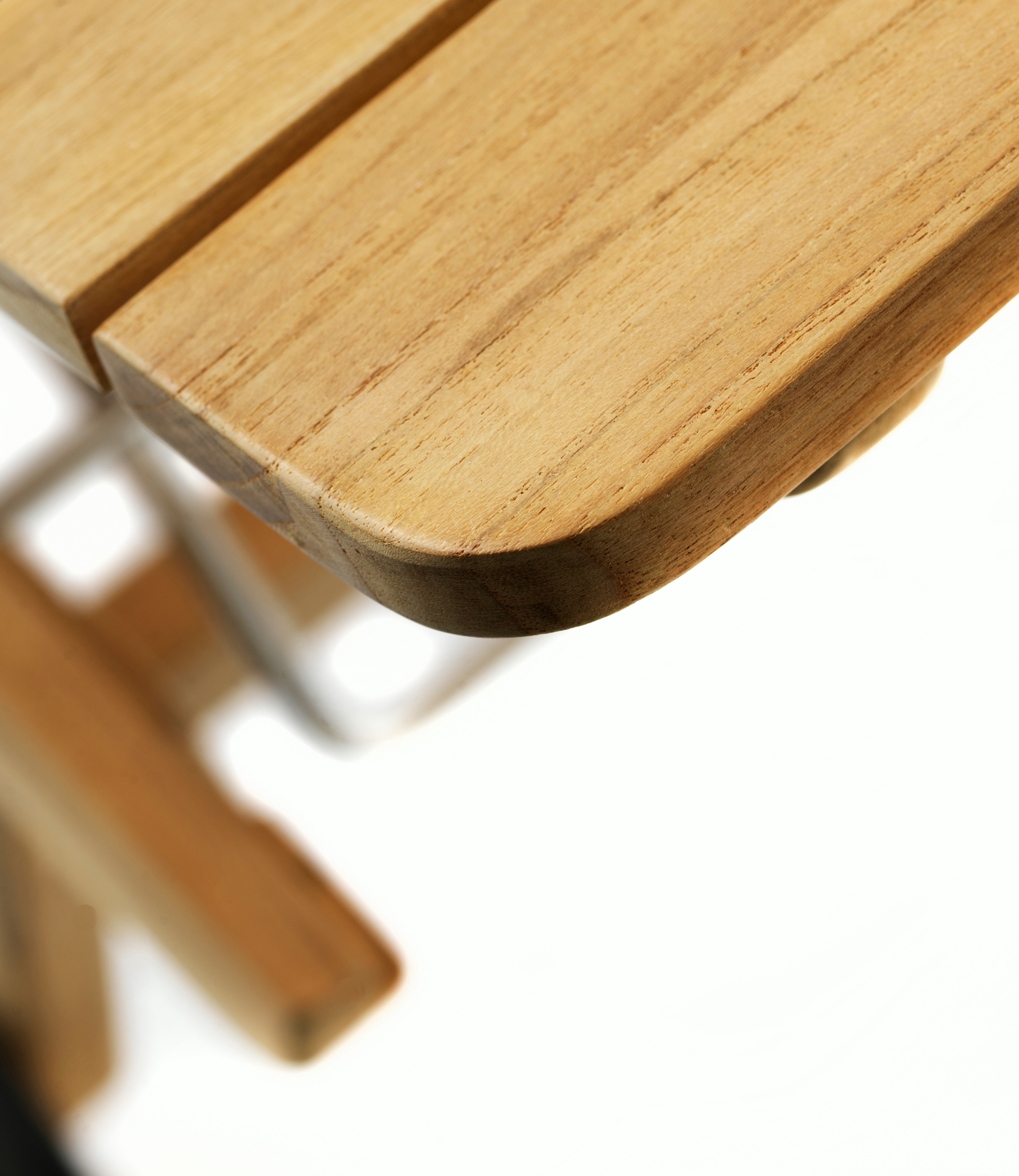 A detailed look at a Sammen Outdoor Bench in Sammen Outdoor Chaise - Natural Teak.