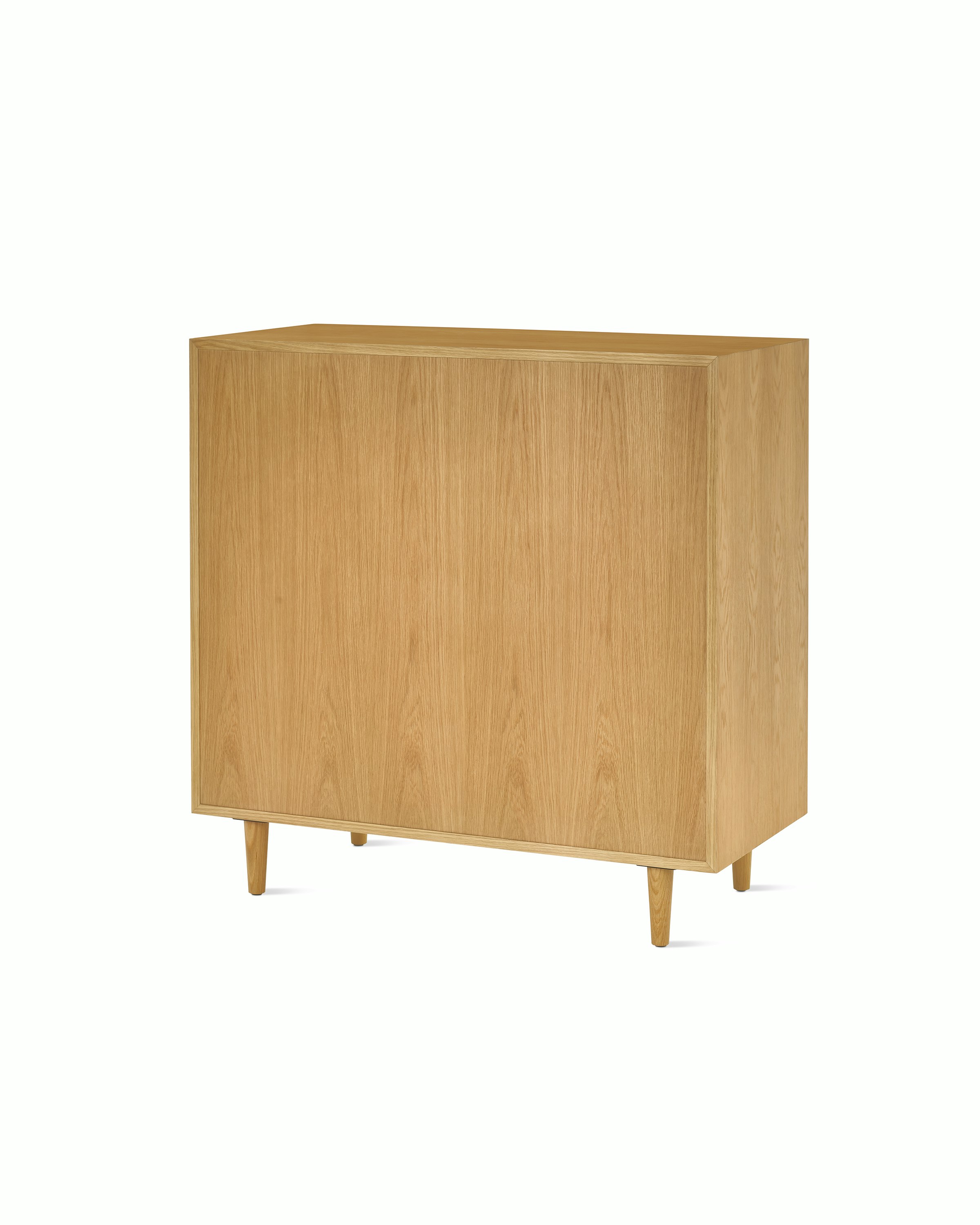Nelson Basic Cabinet Series 5 drawers, one door, taper legs, cupcake pulls, in natural oak.