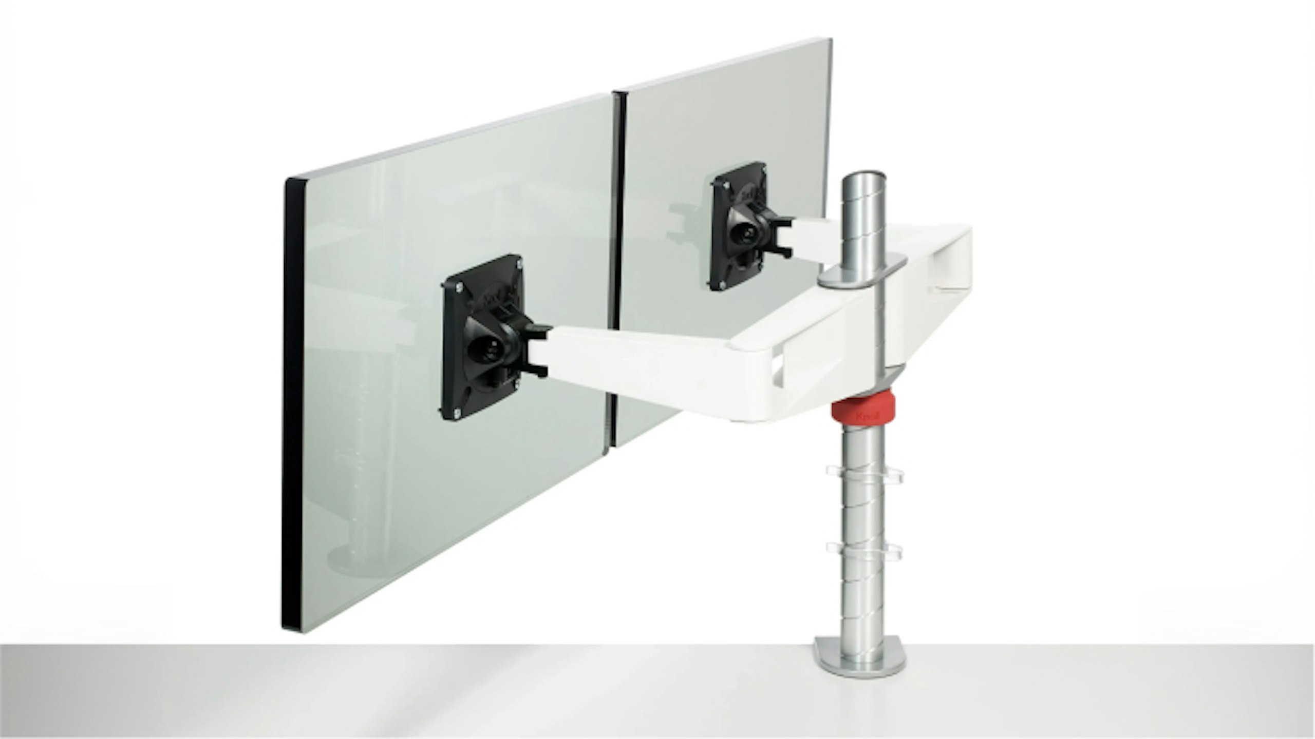 Two computer monitors mounted to a Sapper Double Monitor Arm by Knoll.