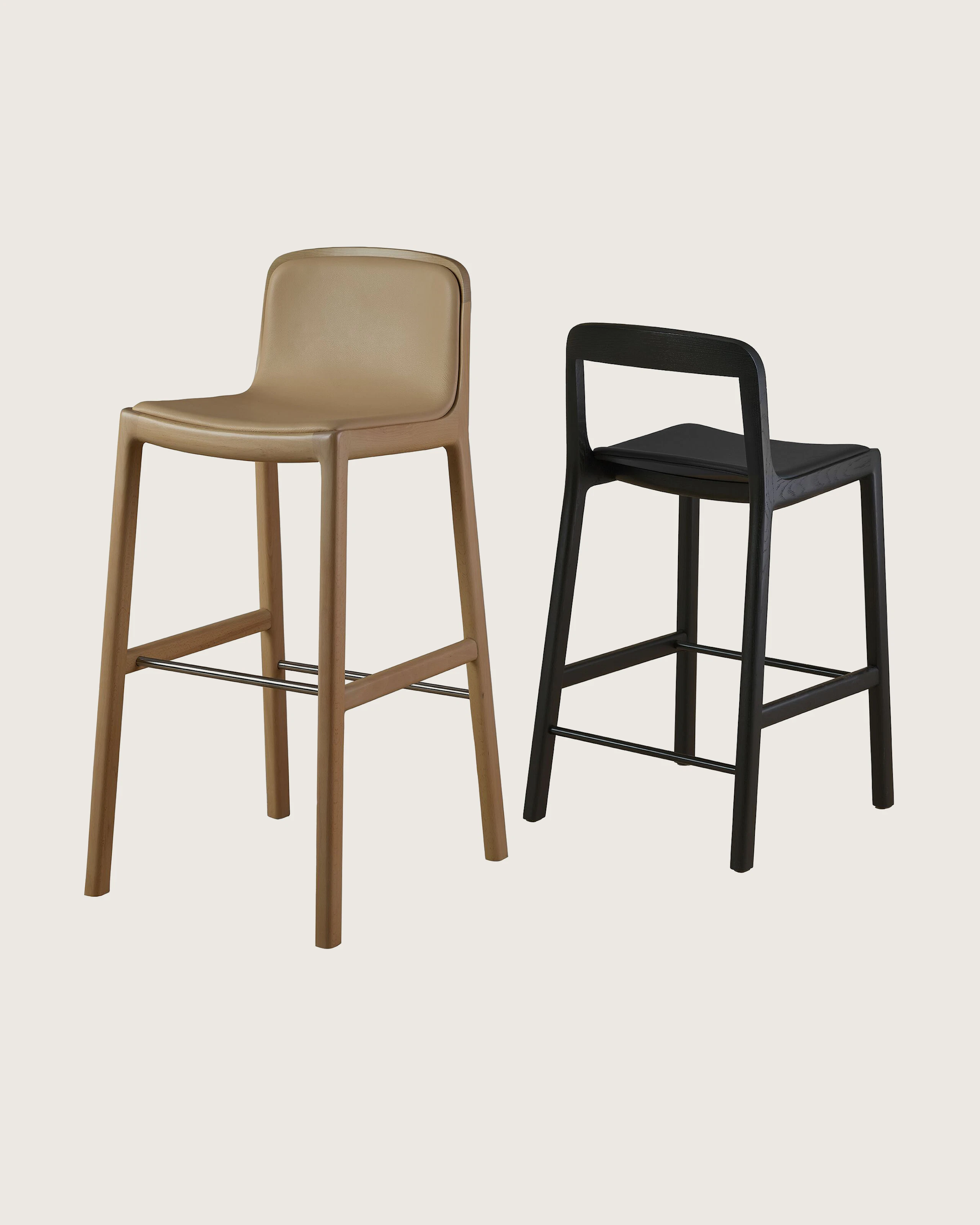 Lijn Stools by Carole Baijings for Geiger in Light Beech and Ebonized Oak on a white sweep.