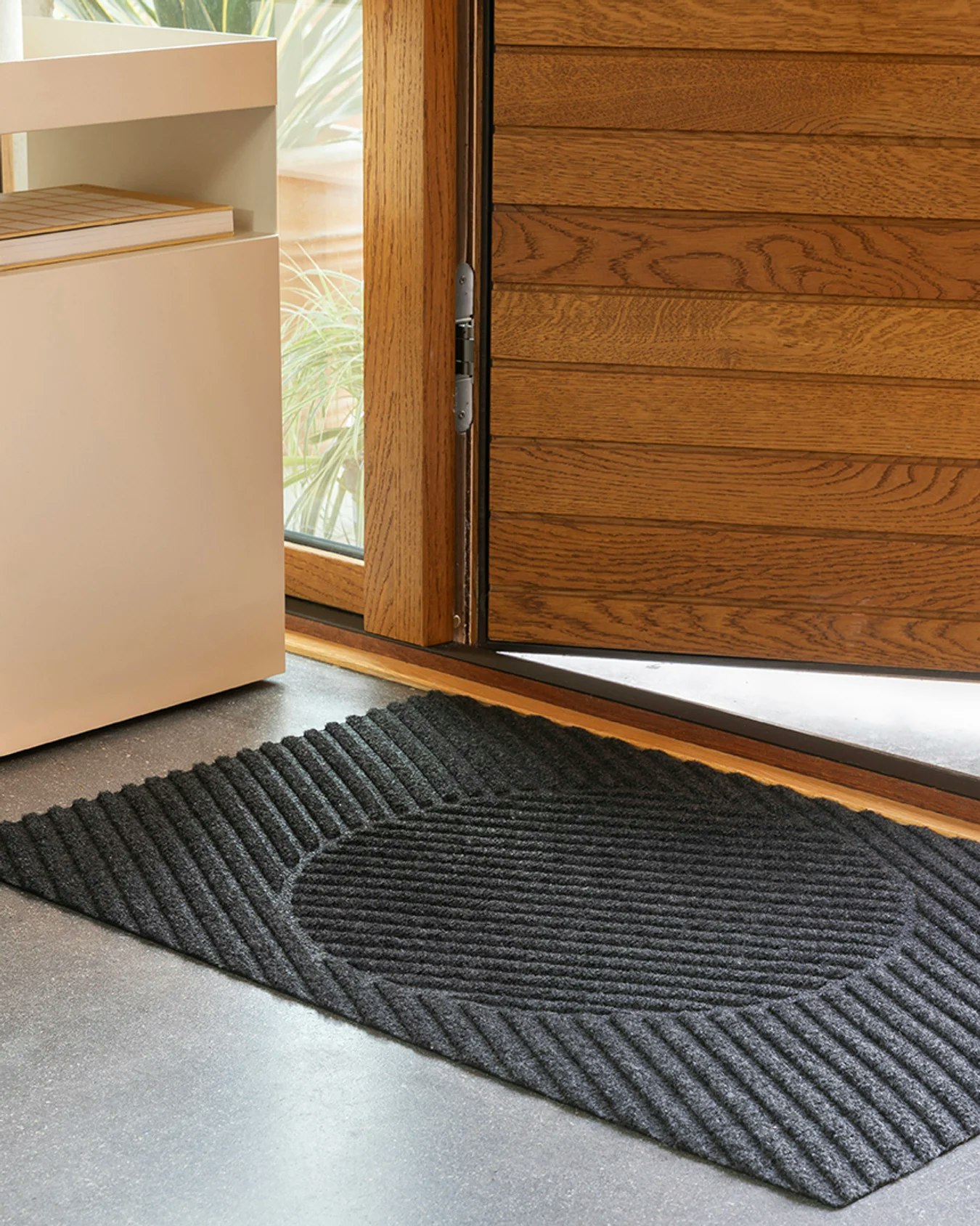 An environmental shot of a Mane Mat - 24 Inch x 35 Inch.