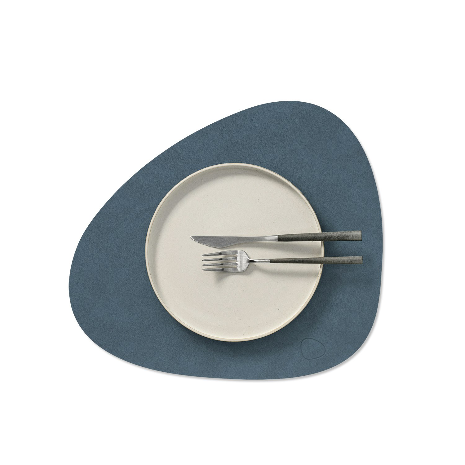 A detailed look at Curve Placemat in dark blue.