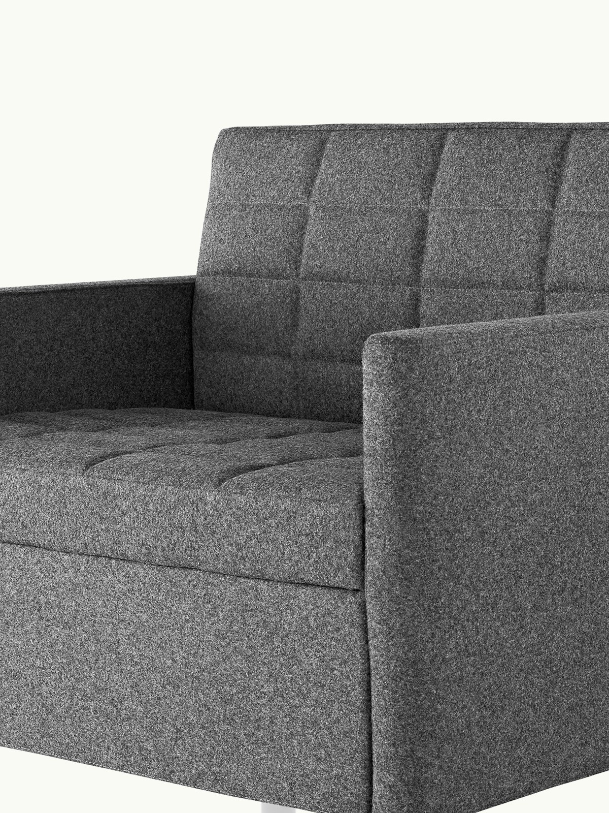 Angled view of a quilted Tuxedo Classic Club Chair upholstered in dark gray fabric.