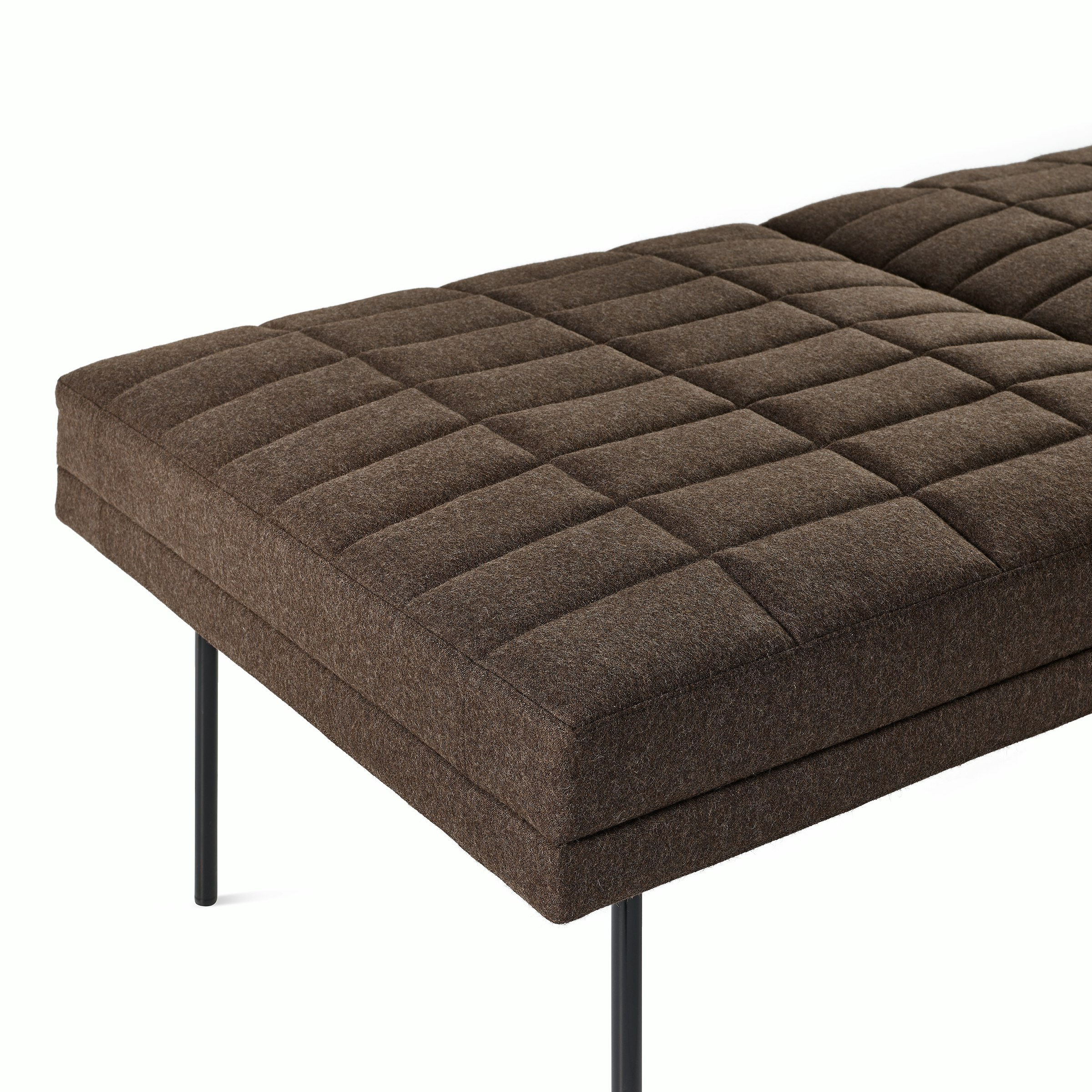 Detail shot of Tuxedo Component Lounge Bench upholstered with Panno di Dolce textile in Umber and black metal legs viewed from an angle.