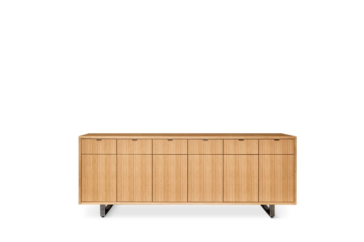 Highline 25 Credenza in Rift Cut European White Oak with Polished Chrome base and pulls, front view.