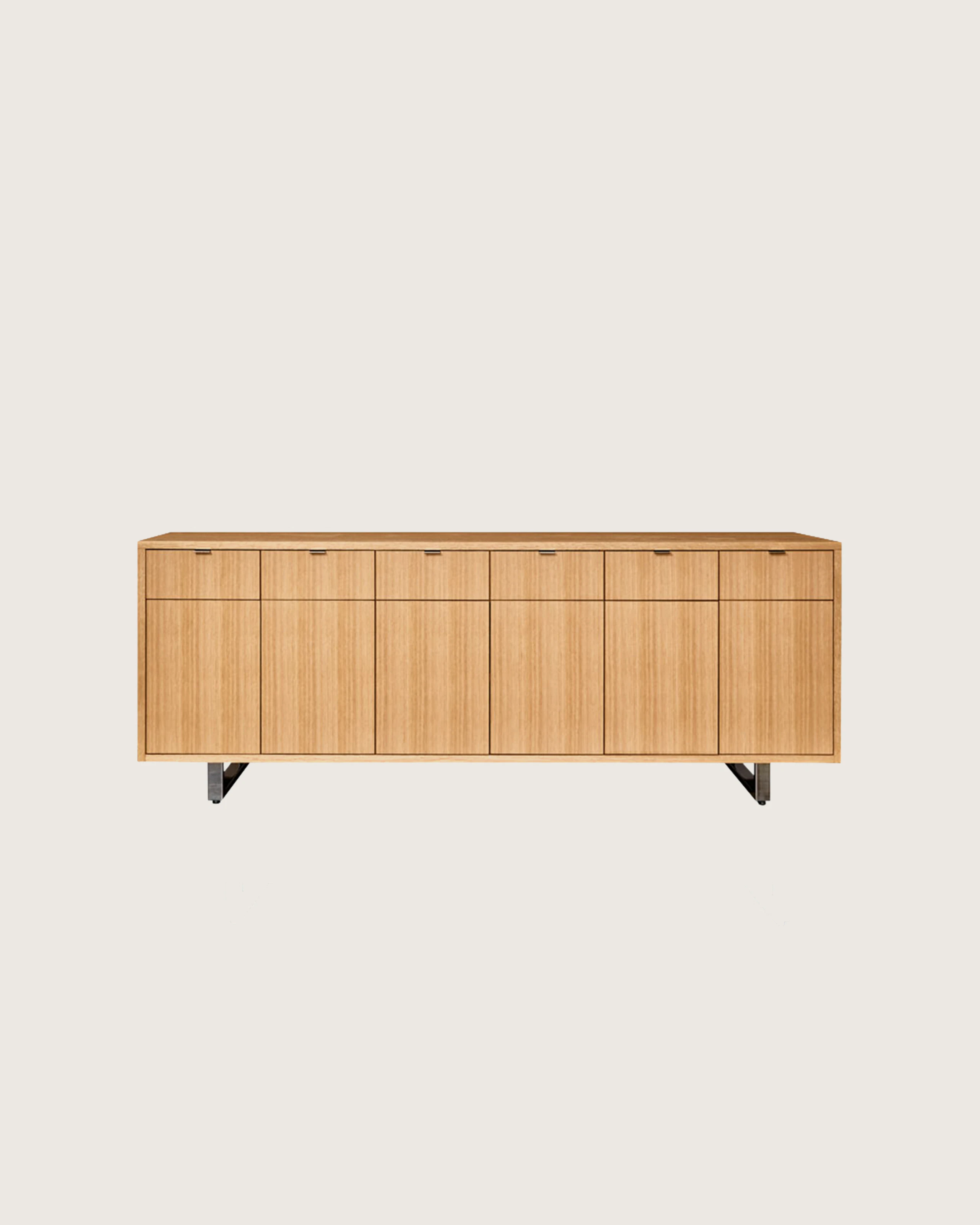 Highline 25 Credenza in Rift Cut European White Oak with Polished Chrome base and pulls, front view.