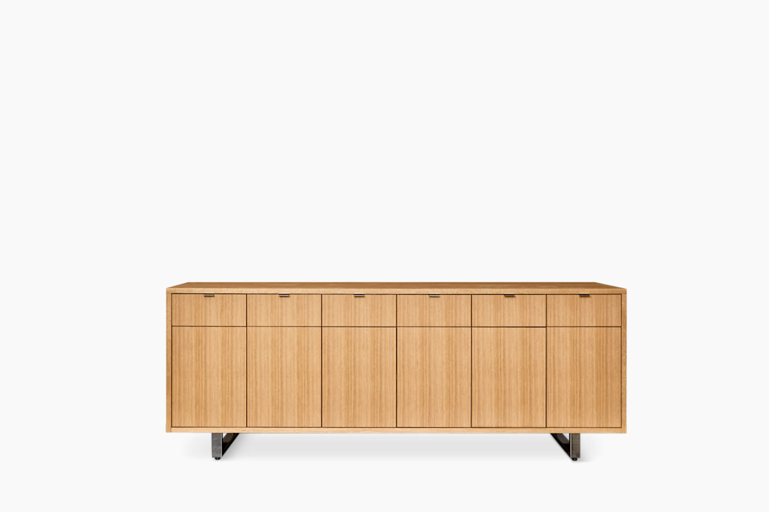 Highline 25 Credenza in Rift Cut European White Oak with Polished Chrome base and pulls, front view.