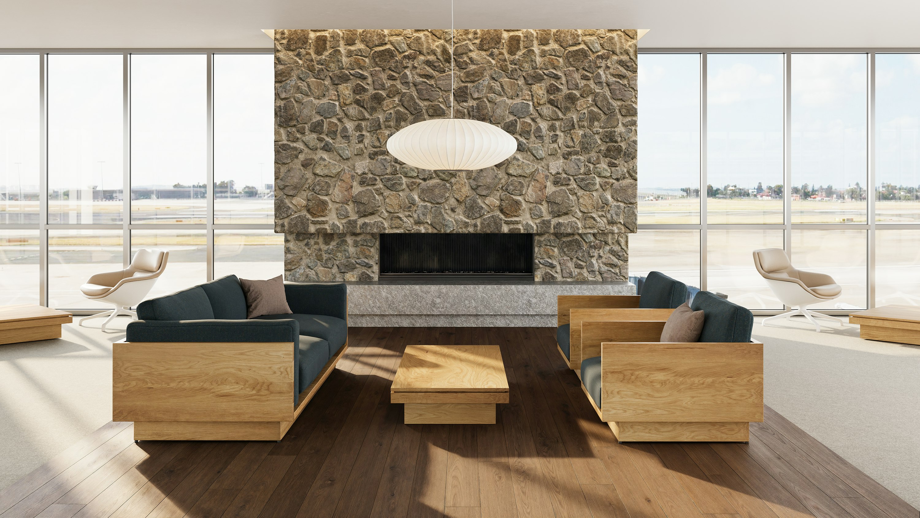 Pawson Drift Coffee Table with walnut finish and walnut top, with Pawson Drift Sofa and Lounge Chairs with walnut finish and green upholstery.