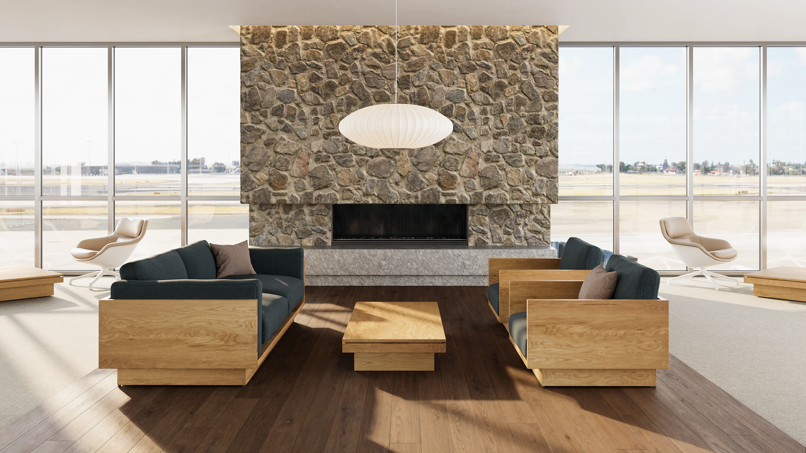 Pawson Drift Coffee Table with walnut finish and walnut top, with Pawson Drift Sofa and Lounge Chairs with walnut finish and green upholstery.