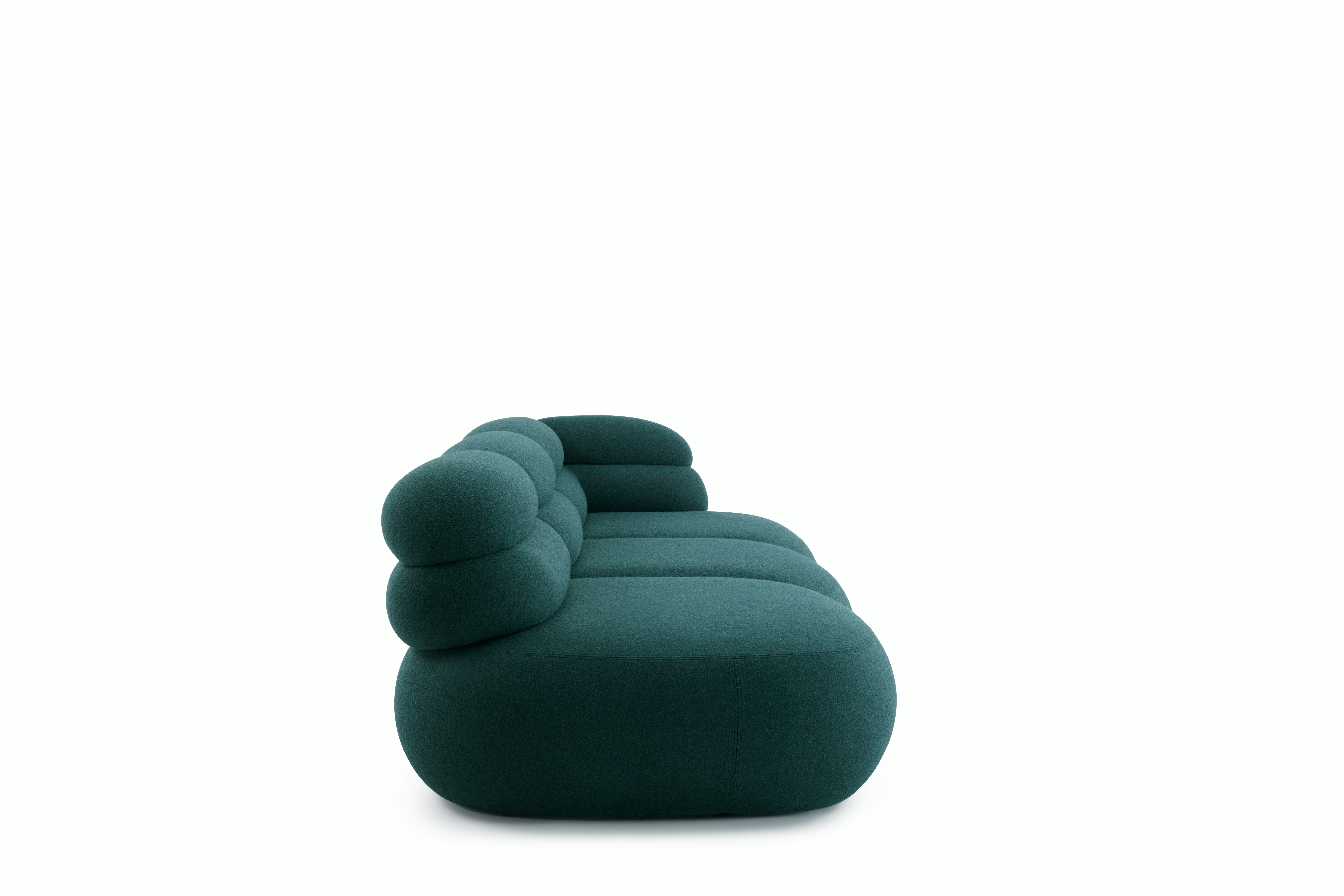 A Biboni Open End Sofa in Stellium, Midnight Teal viewed from the side.