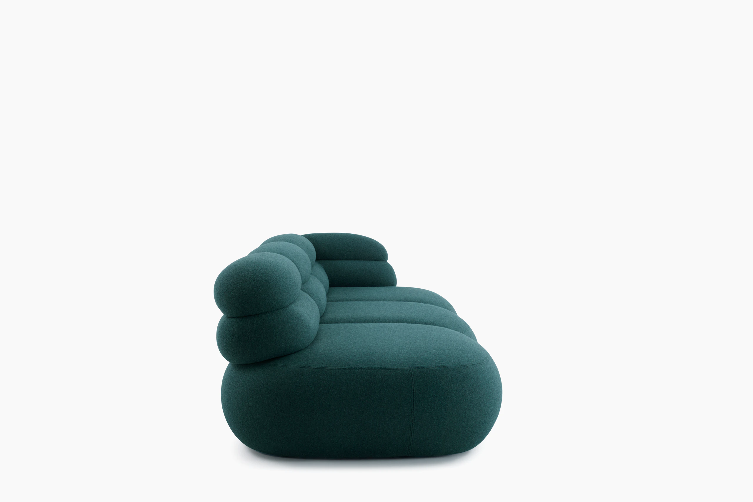A Biboni Open End Sofa in Stellium, Midnight Teal viewed from the side.