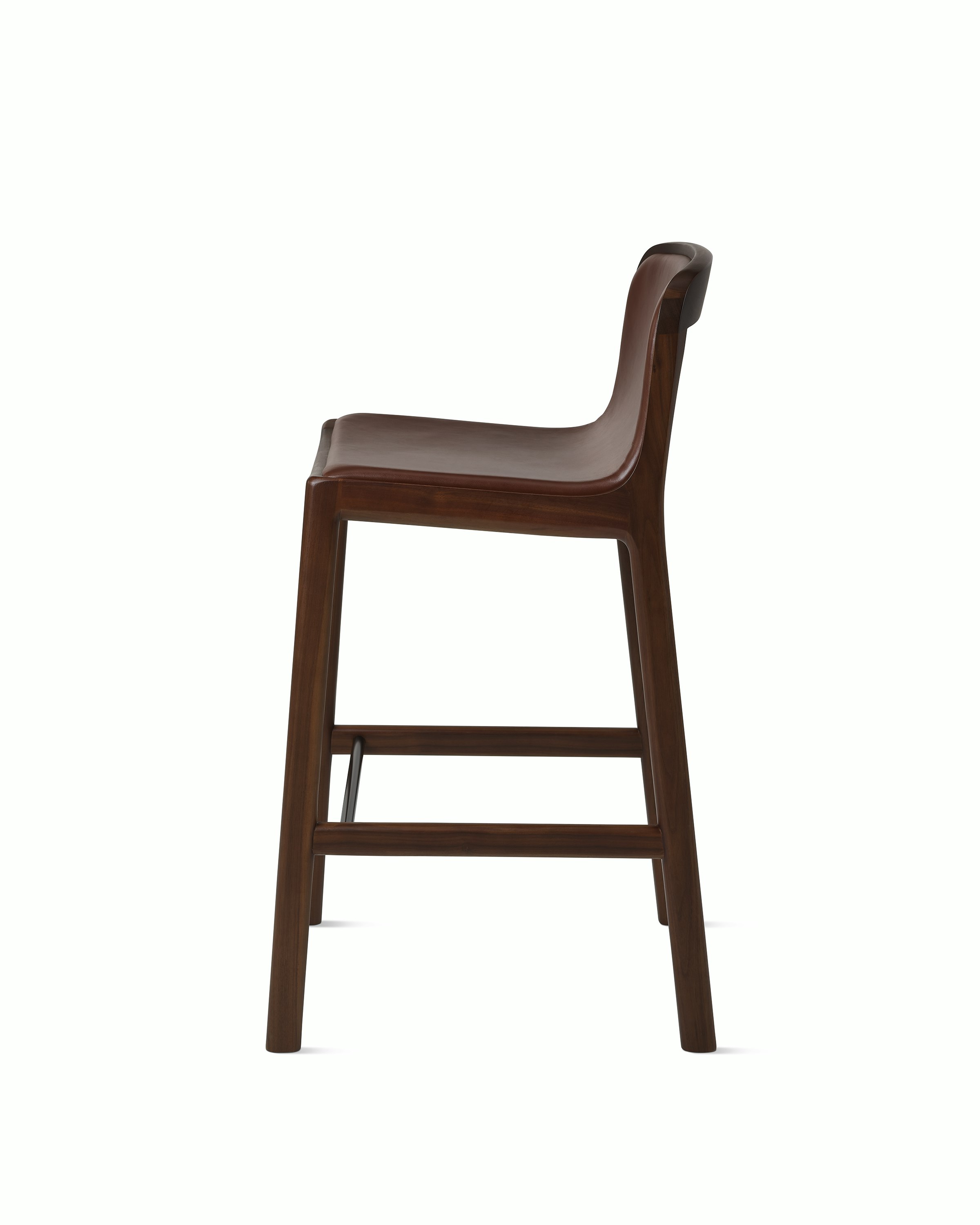 Lijn Stool by Carole Baijings for Geiger in Persian Walnut frame upholstered with Maharam Hue Leather in Bittersweet, side view on a white sweep.