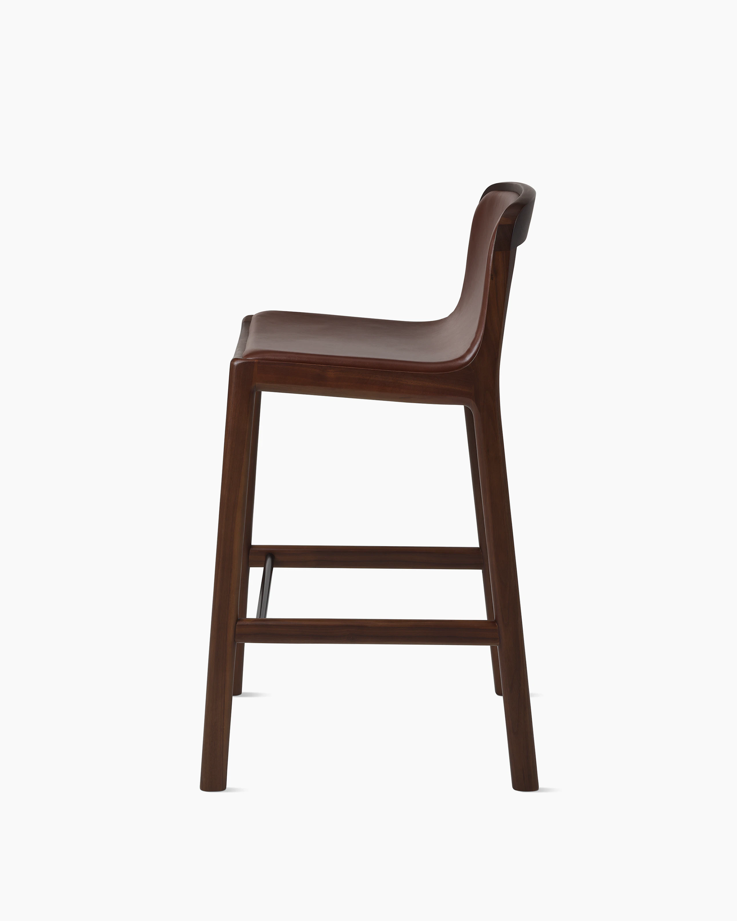 Lijn Stool by Carole Baijings for Geiger in Persian Walnut frame upholstered with Maharam Hue Leather in Bittersweet, side view on a white sweep.