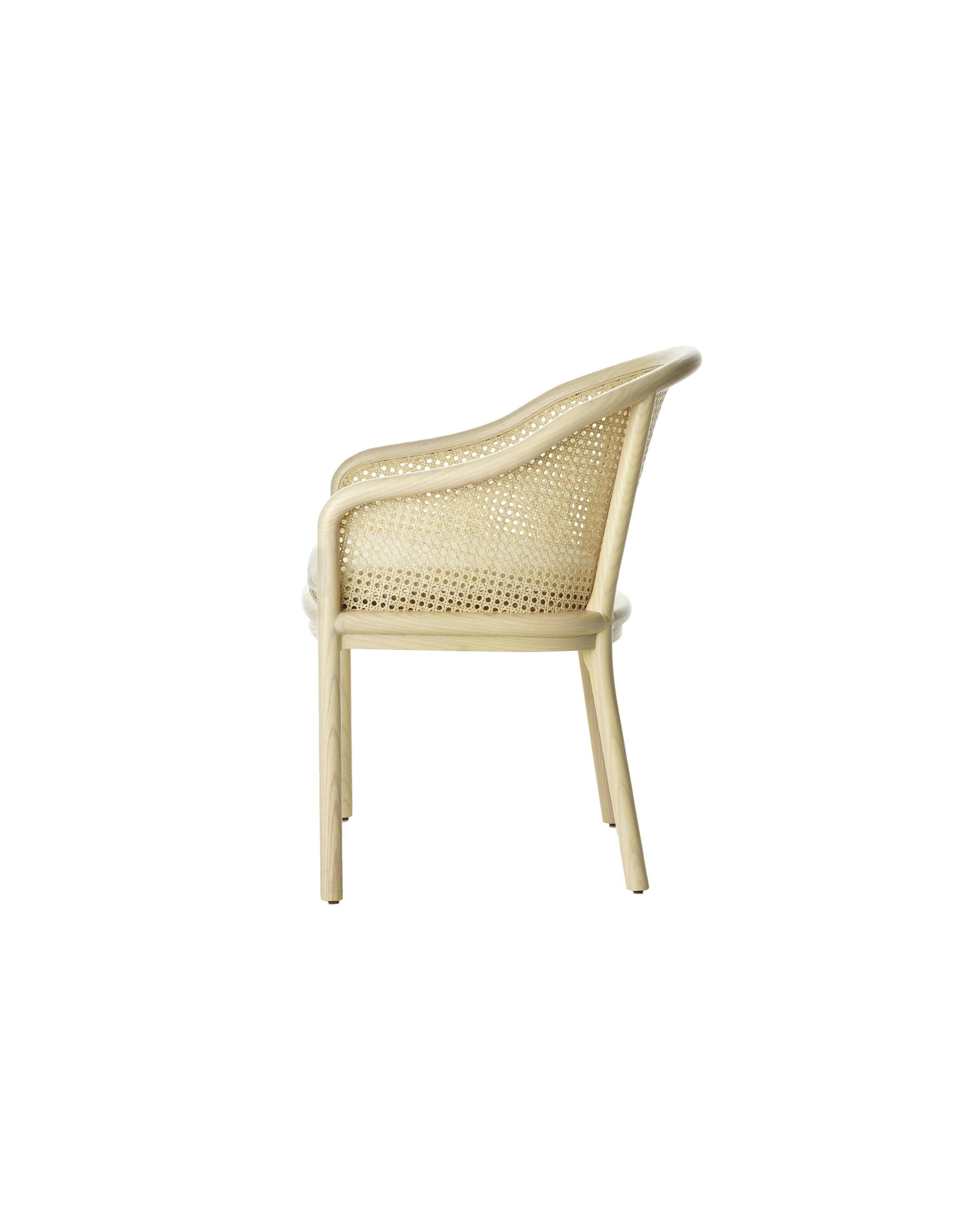 Landmark Chair with a cane back and a seat upholstered in a Double Beam textile, viewed from the side.