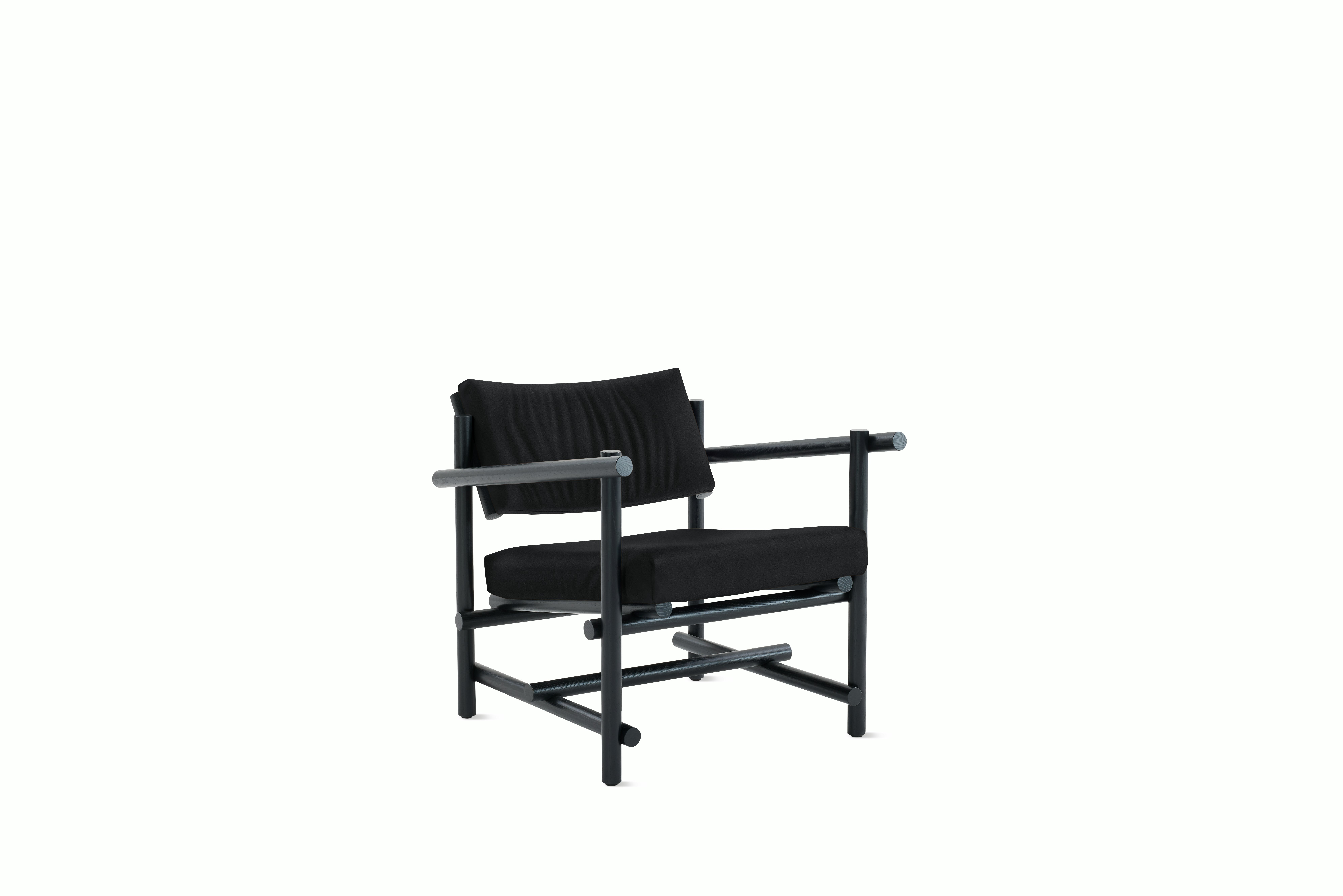 A Muecke Lounge Chair in Black Ebonized Ash viewed from an angle.