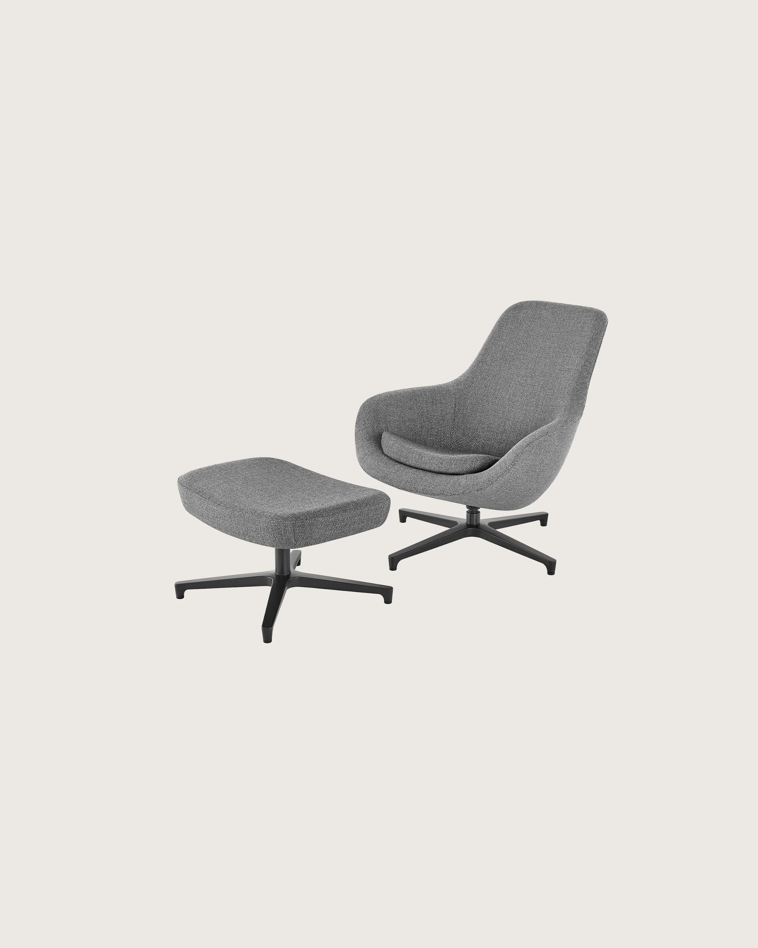Angled view of a Saiba Lounge Chair and Ottoman with gray upholstery.