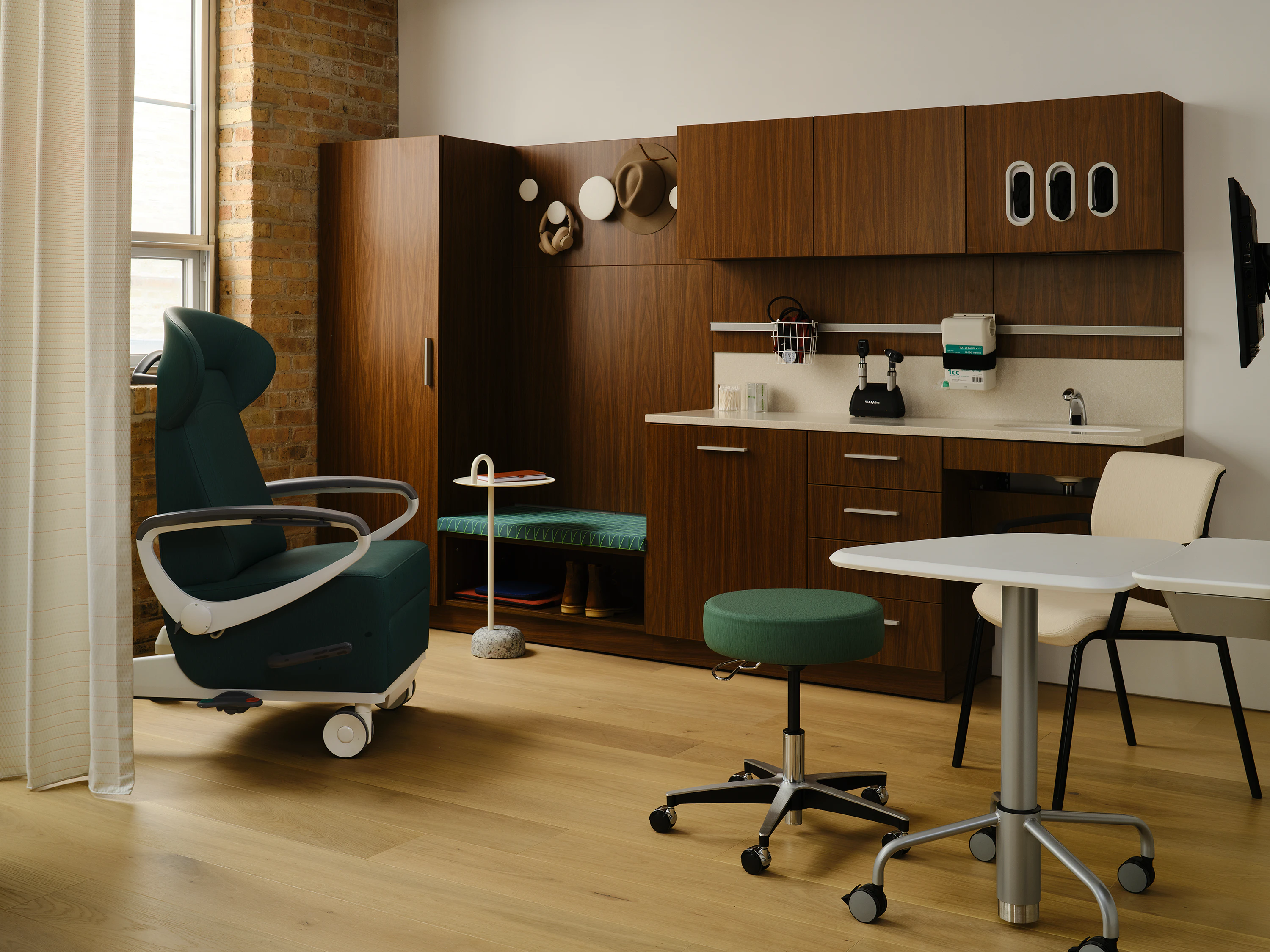 Exam room setting featuring Mora System, Intent Solution in a dark finish.