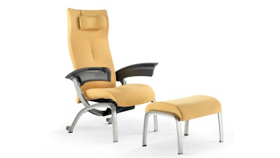 A front three-quarter view of a yellow Nemschoff Nala Patient Chair and Ottoman by Herman Miller.