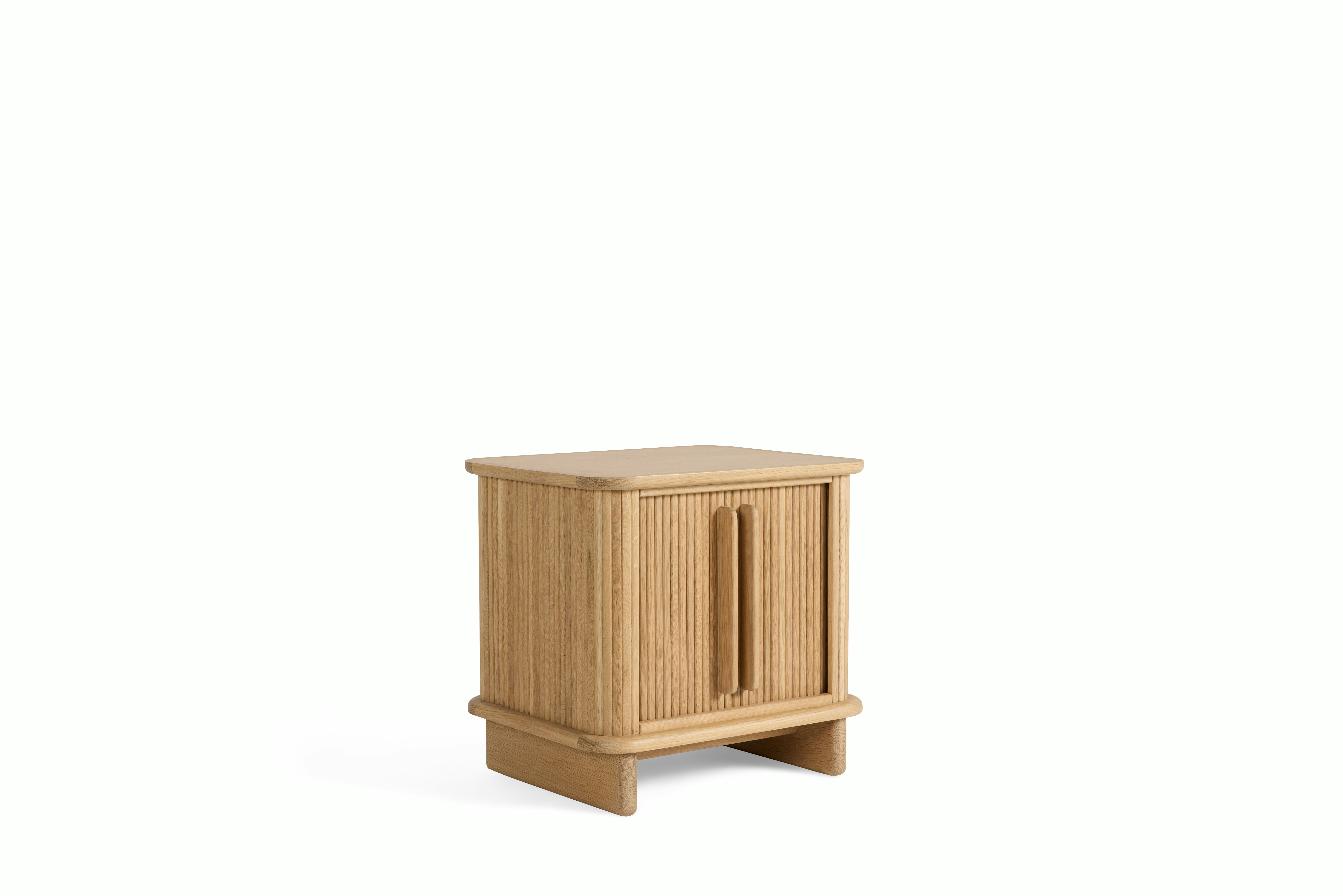 A Noviembre Bedside Table in Oak viewed from an angle.