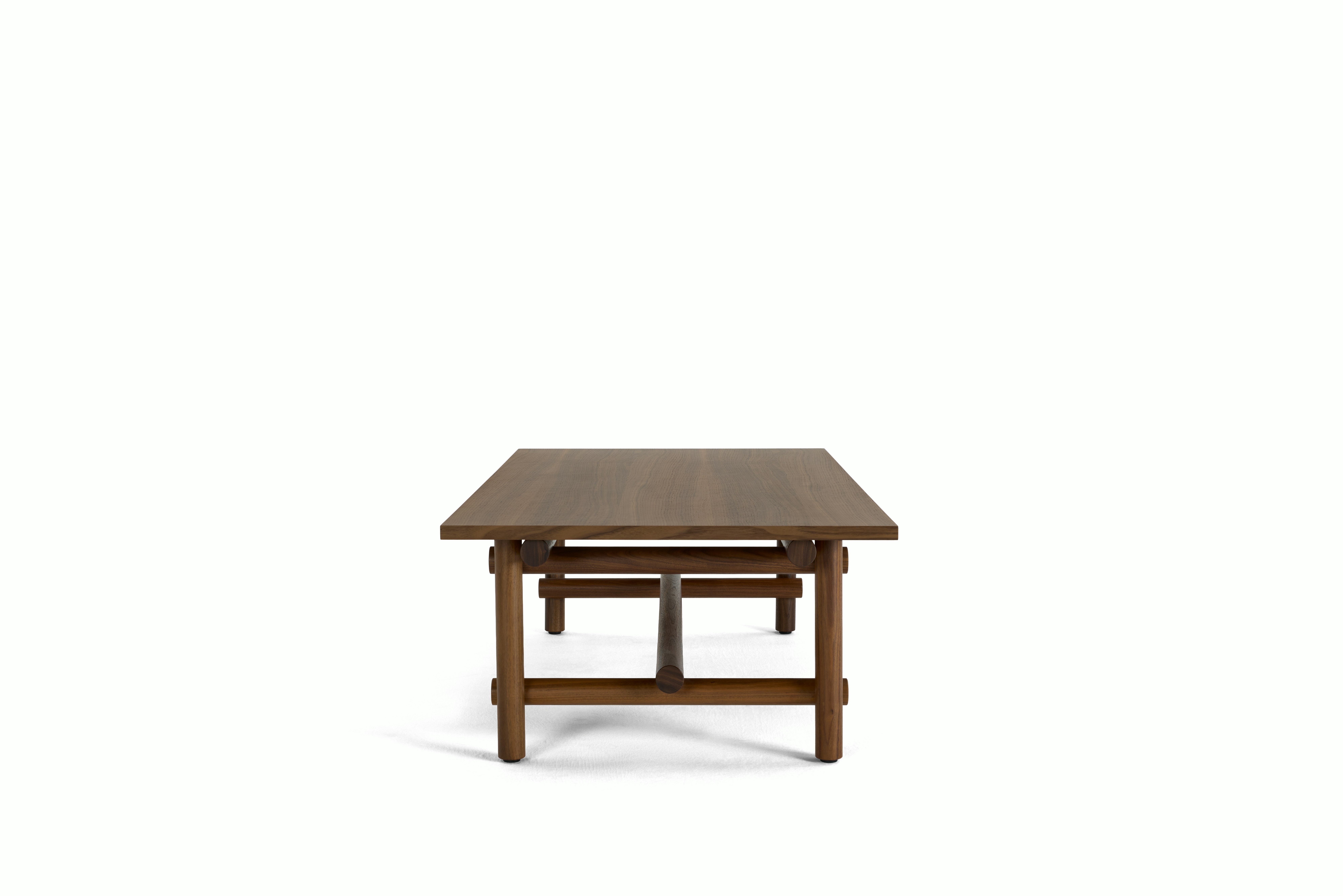 A Muecke Coffee Table in Walnut viewed from an angle.