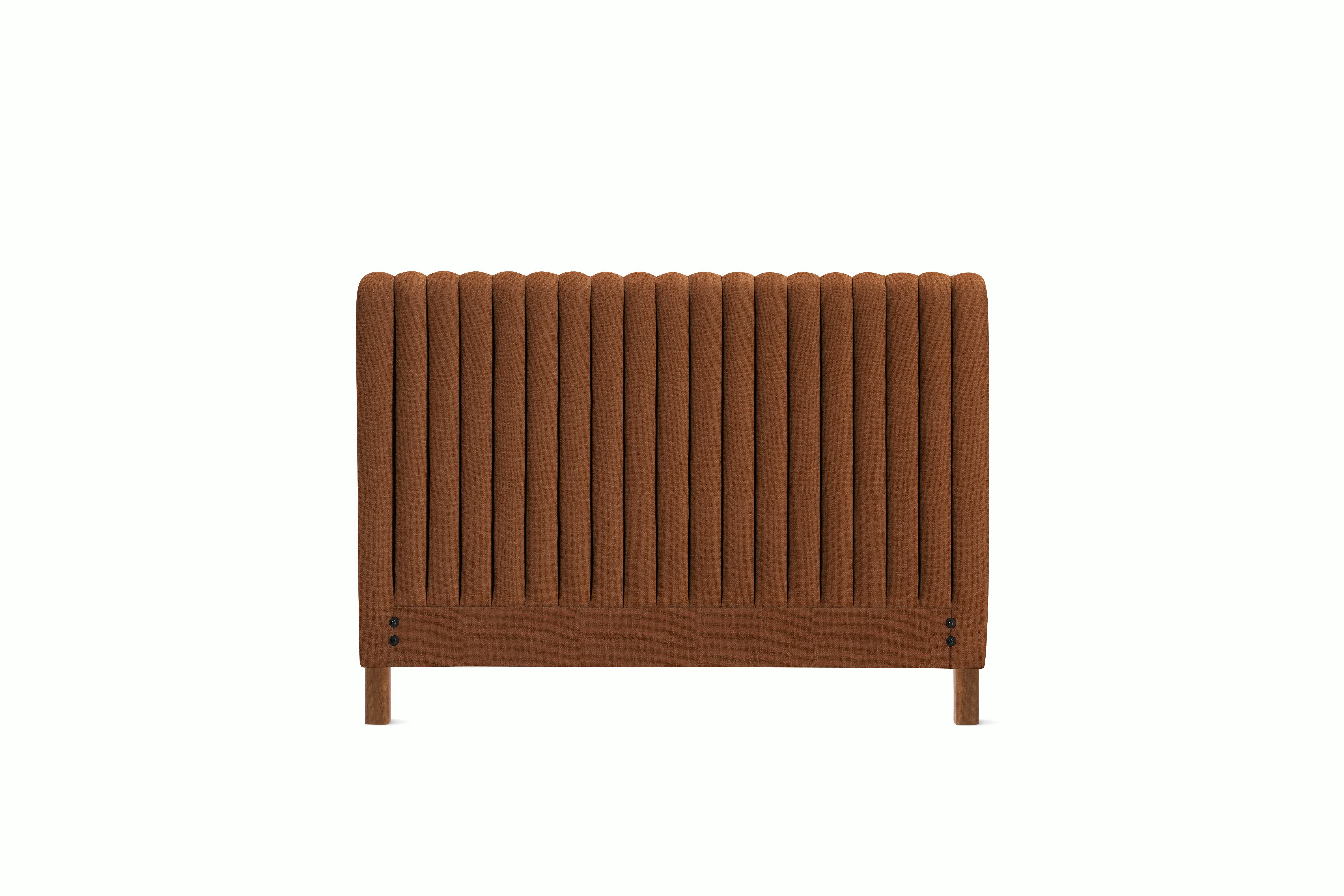 A Charlotte Headboard in Rattan viewed from an angle.