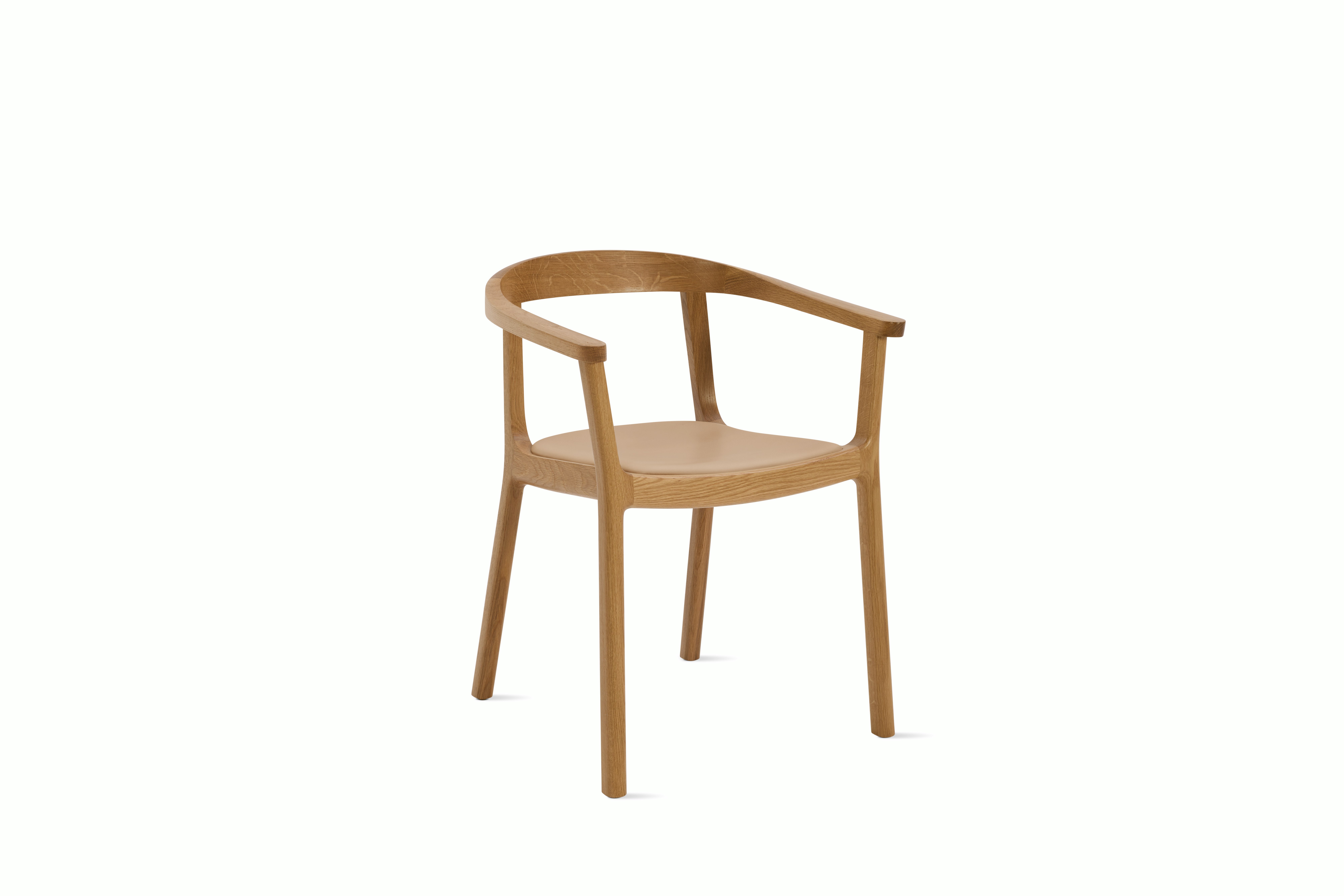 A Lijn Armchair in Balsa Oak viewed from an angle.